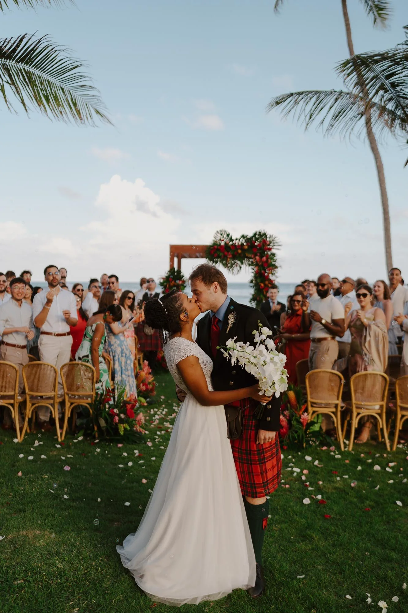 Bride and groom kissing after walking down the aisle at the end of the ceremony Chez Bisutti Punta Cana