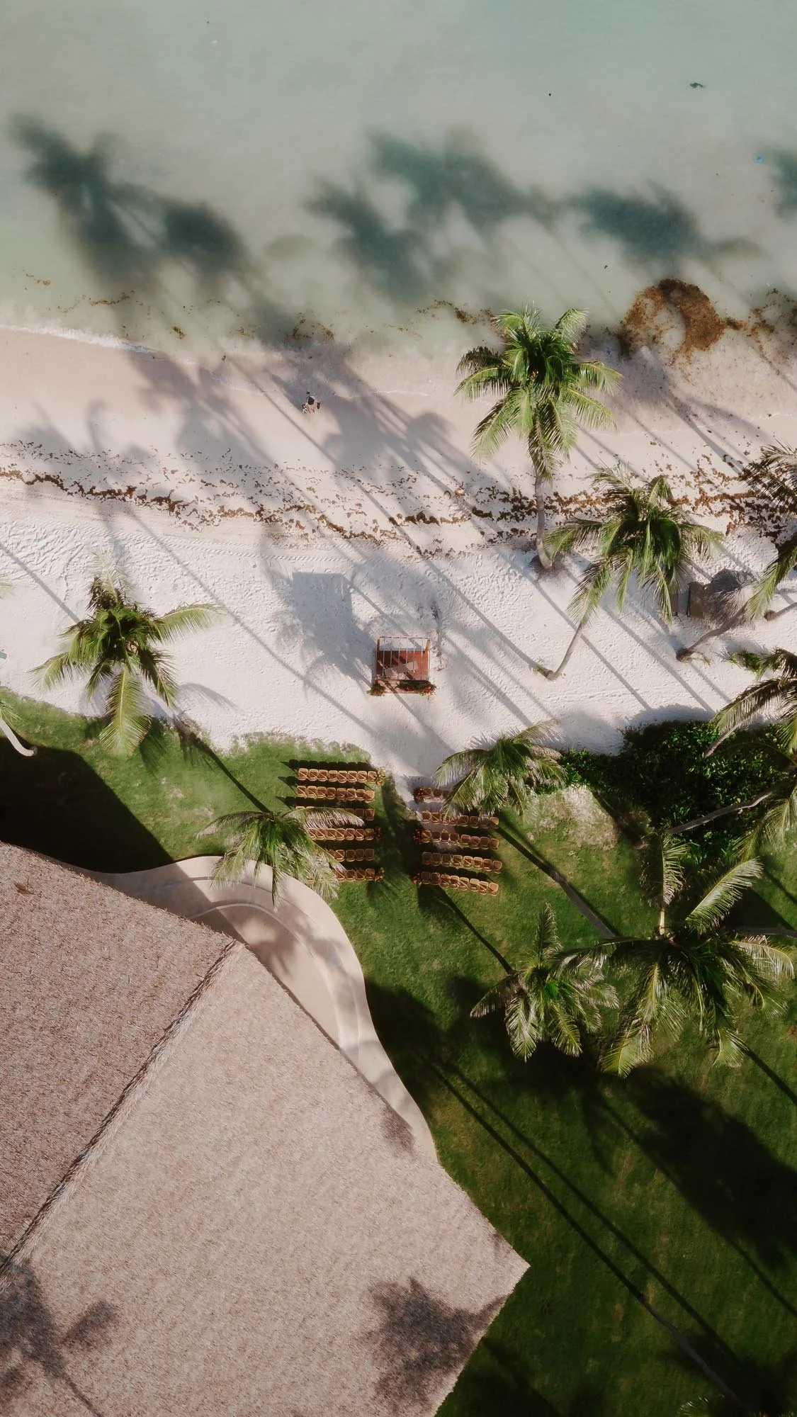 Ceremony setting close to the beach. View from the sky with a dron. Beach and water in Chez Bisutti Punta Cana