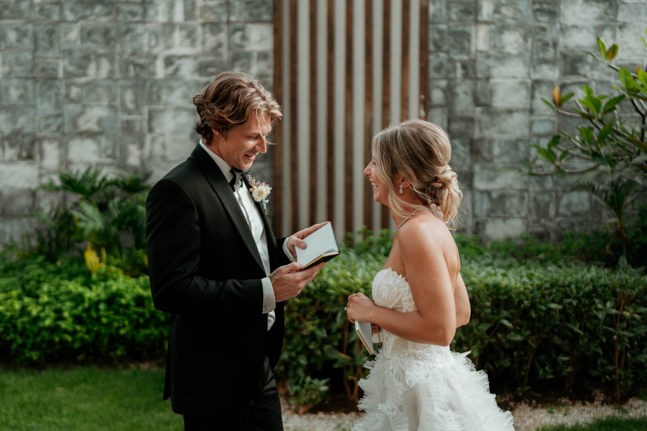 Groom reading the vows to the bride