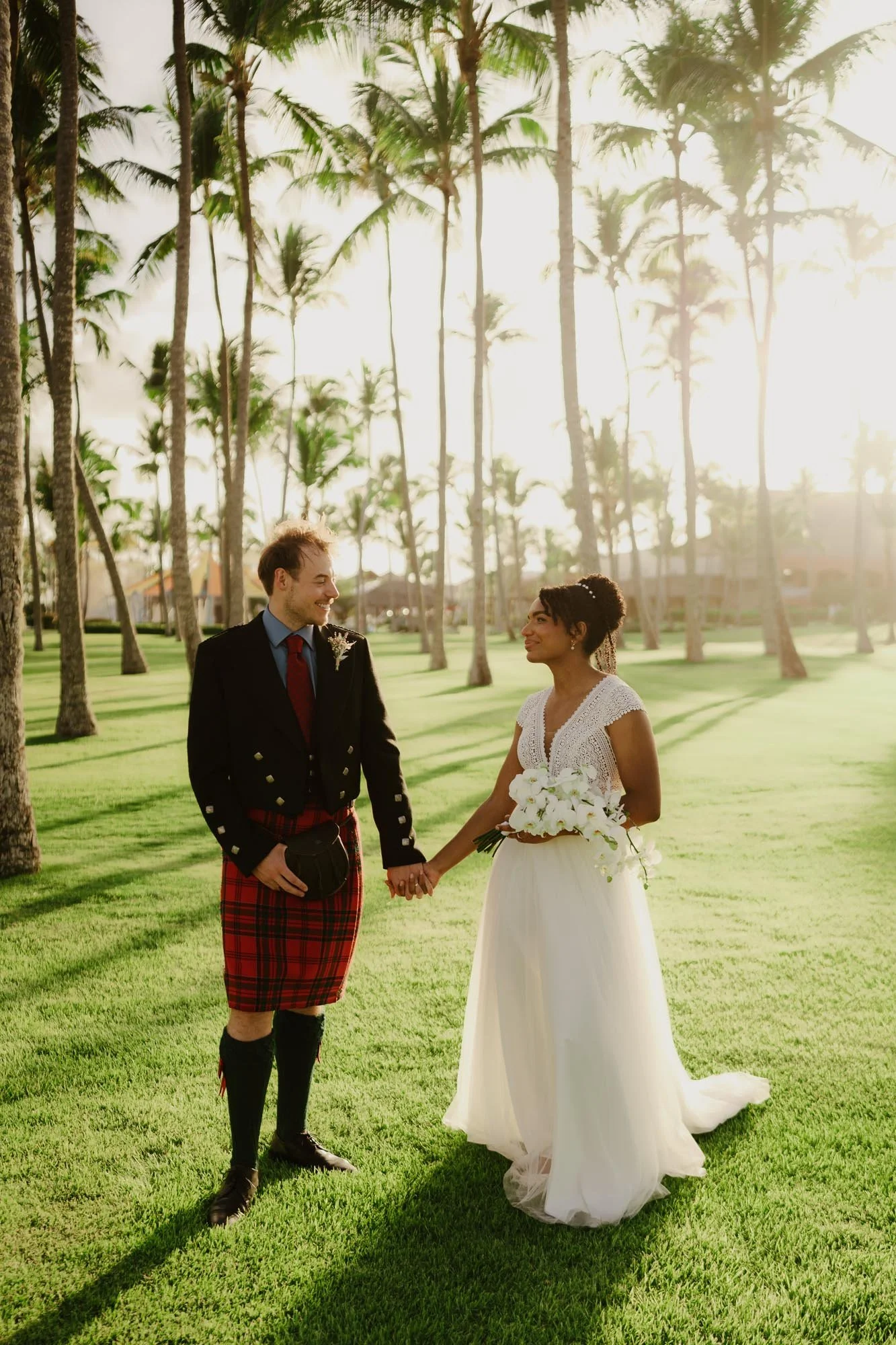 bride and groom holding hands in chez bisutti punta cana wedding dominican republic