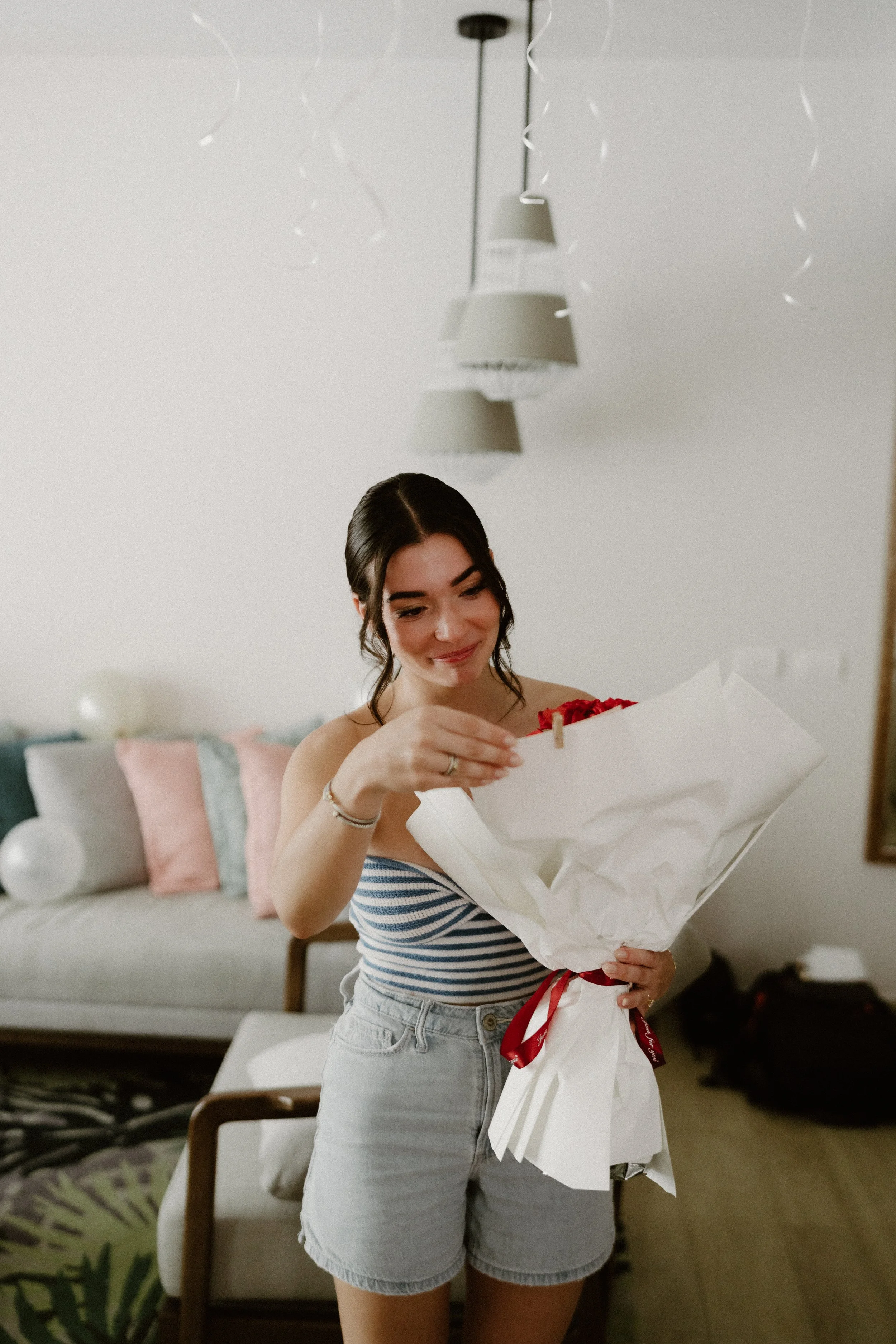 Bride holding red bouquet of flowers