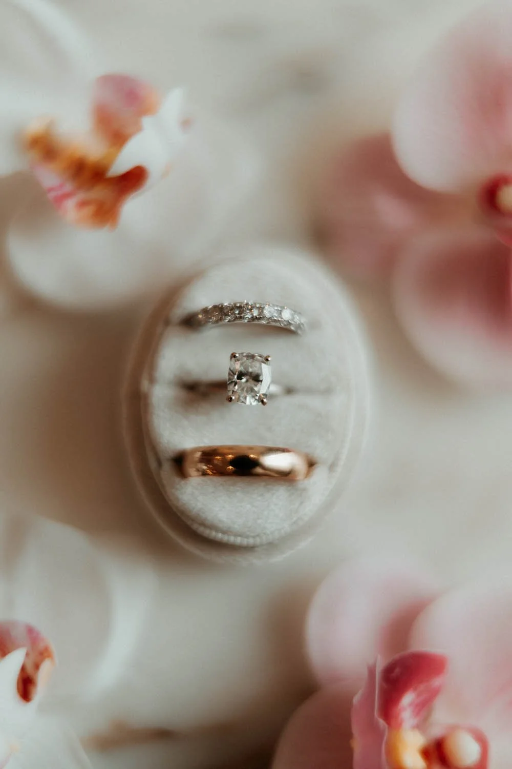 white wedding ring box around flowers