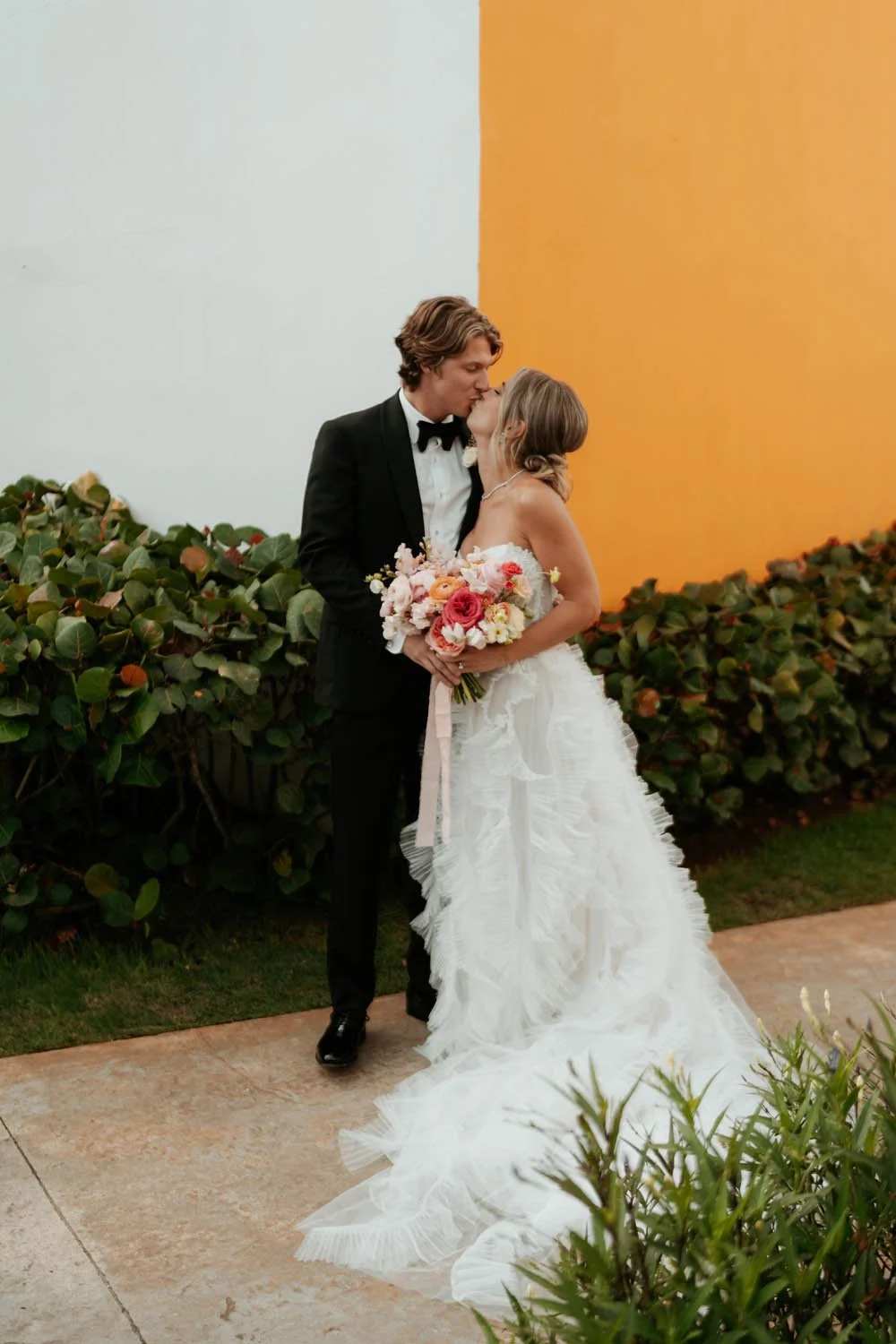 Bride ang groom sharing a kiss after the first look