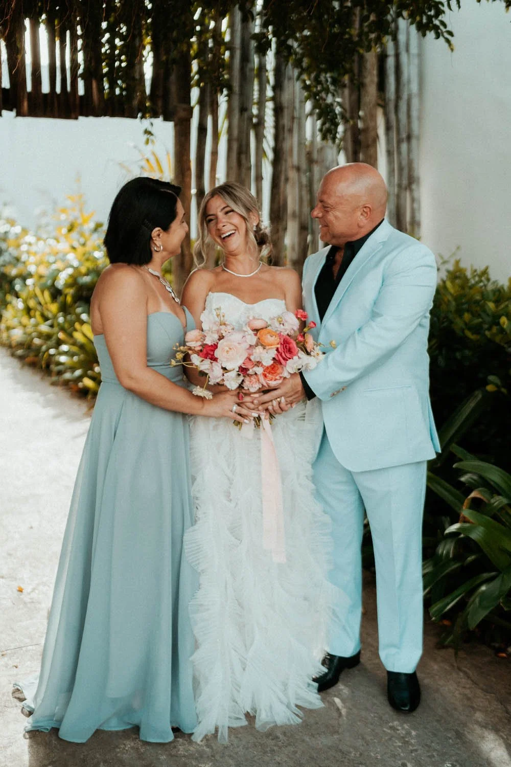 Mom and dad photo with the bride