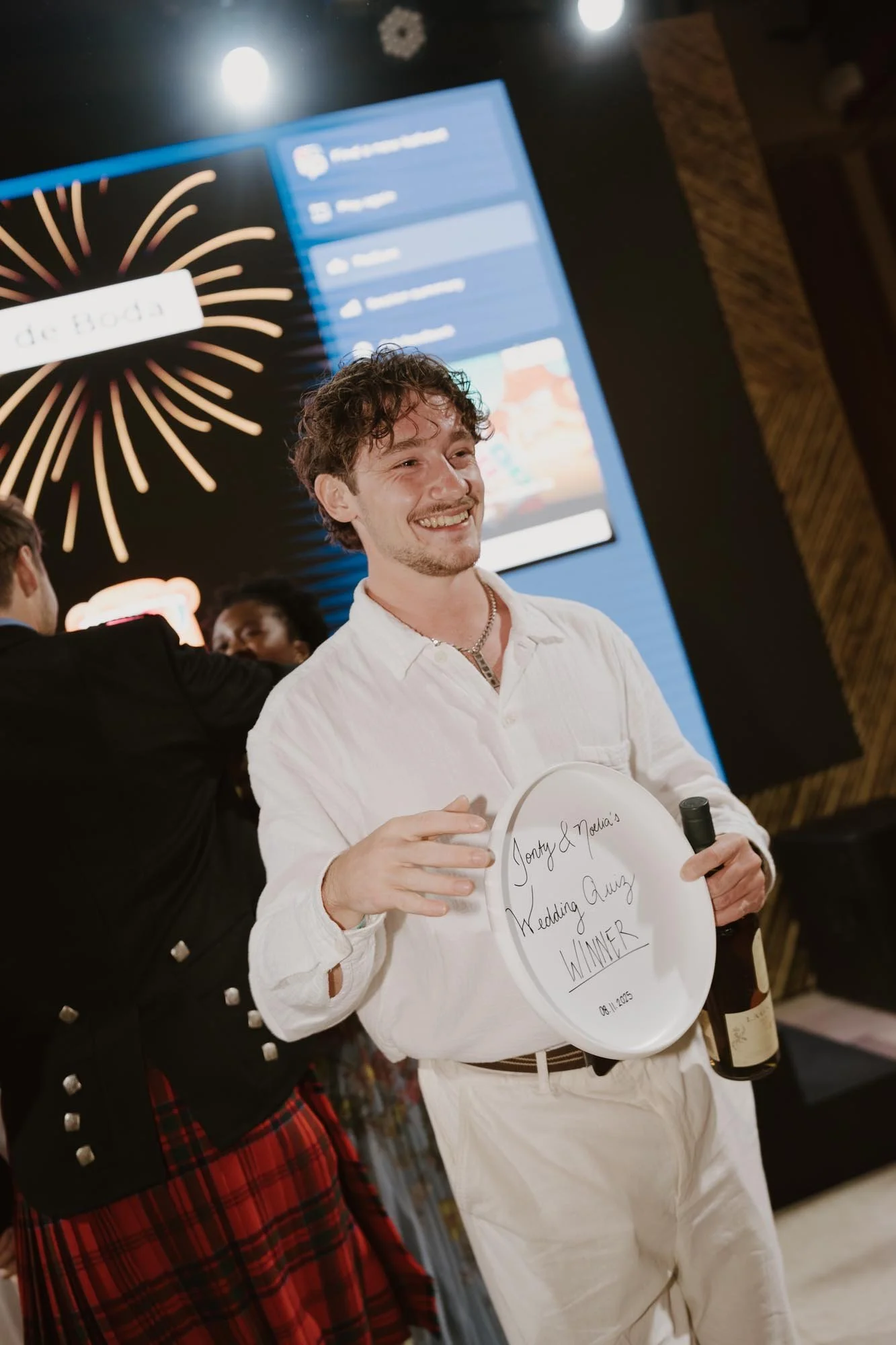 Candid and energetic wedding reception party in Punta Cana, with guests dancing and celebrating under warm lights