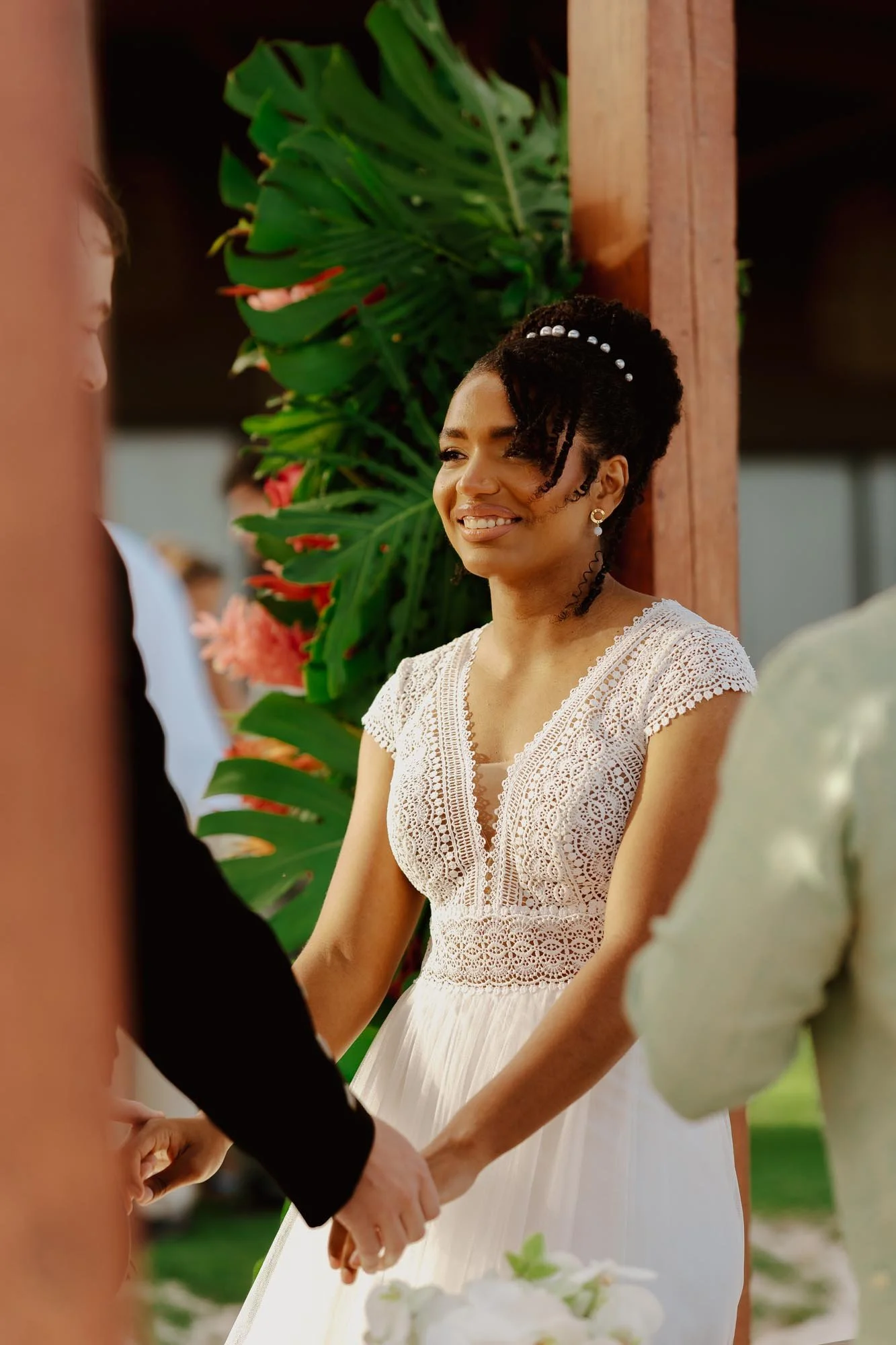 Bride holding hands with groom in the ceremony in Chez Bisutti Punta Cana
