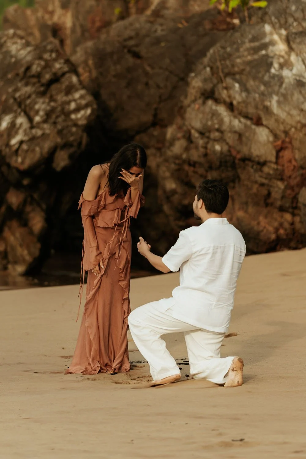 Emotional proposal in El Valle Samaná with couple embracing on the beach