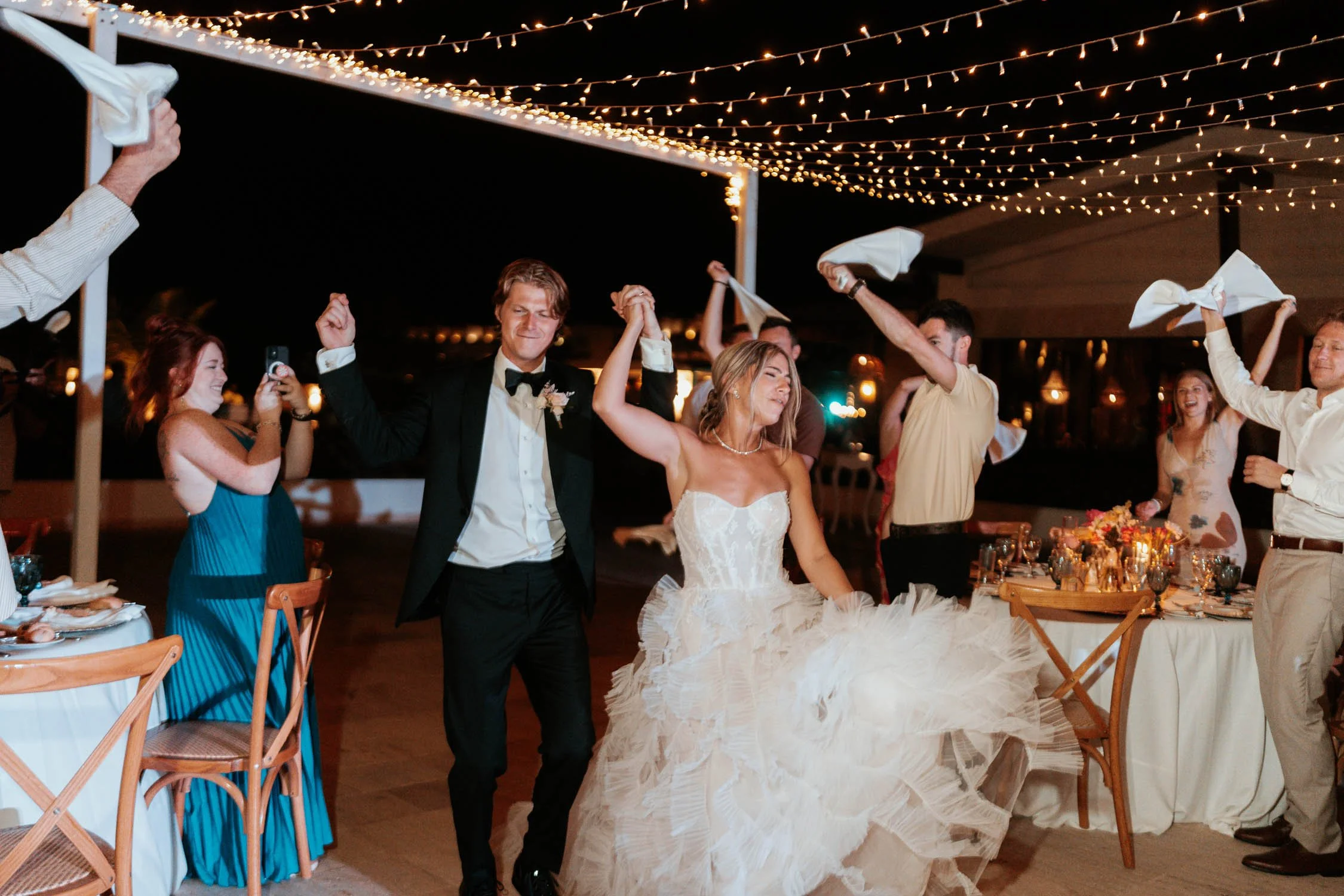 bride and groom entering to the celebration