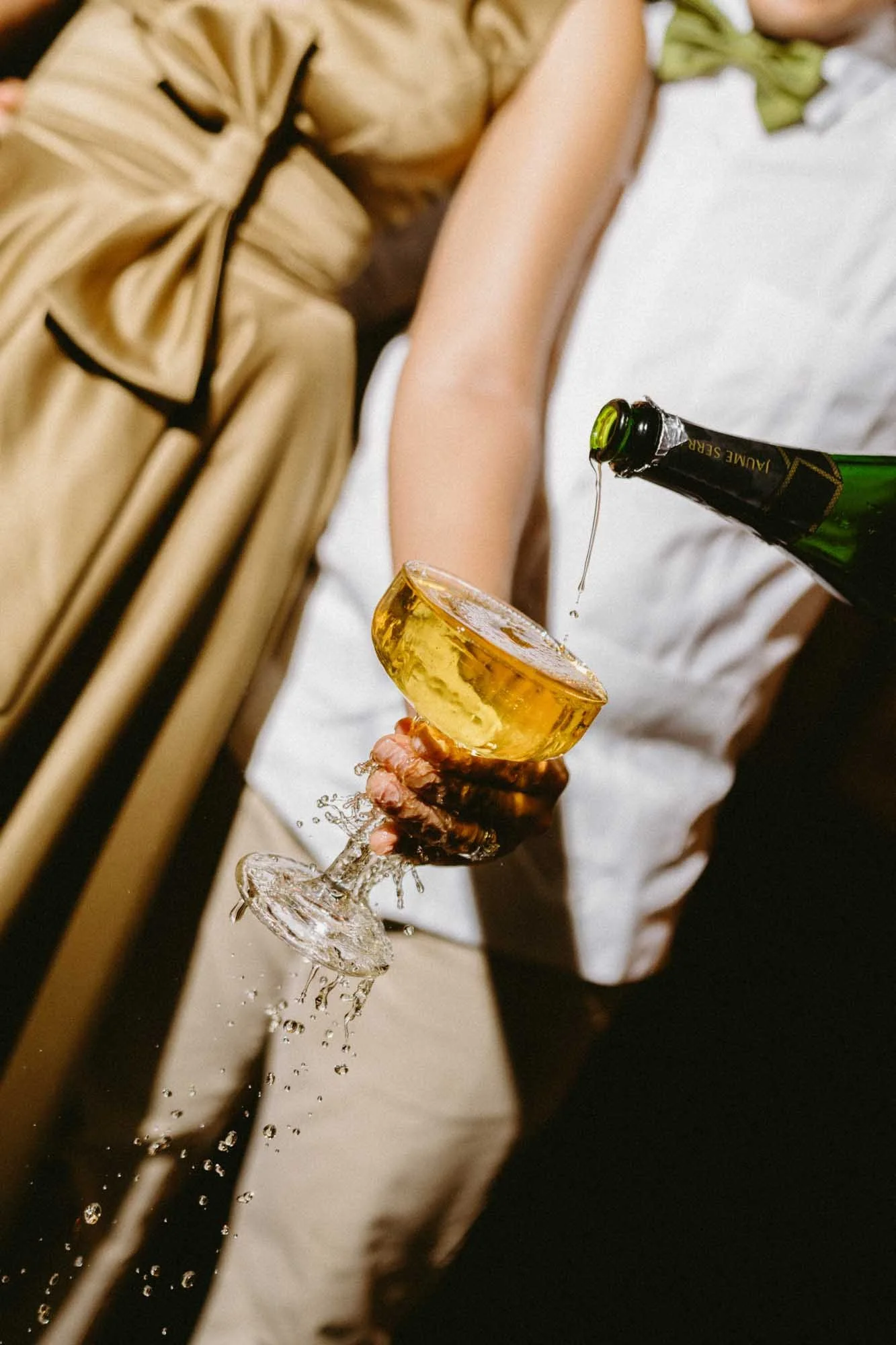 Night wedding photography with direct flash, champagne pop celebration in Dominican Republic.