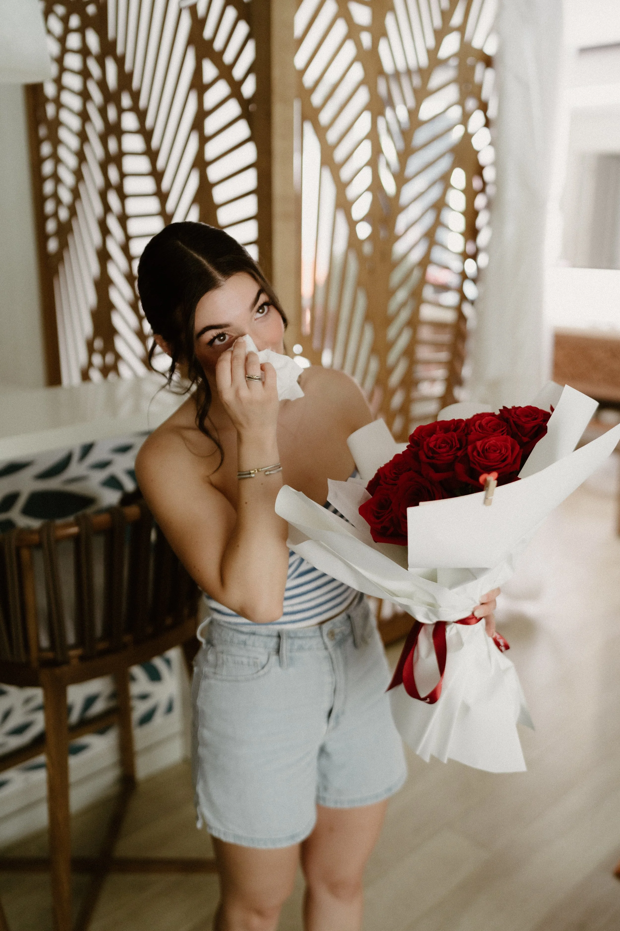 bride tearing up while reading a letter from her husband
