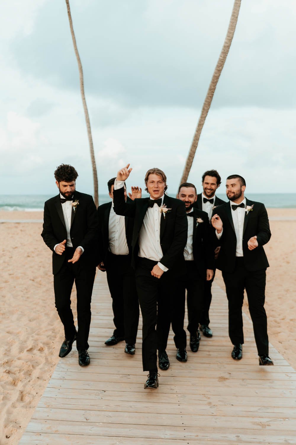 candid moment of the groom with groomsmens