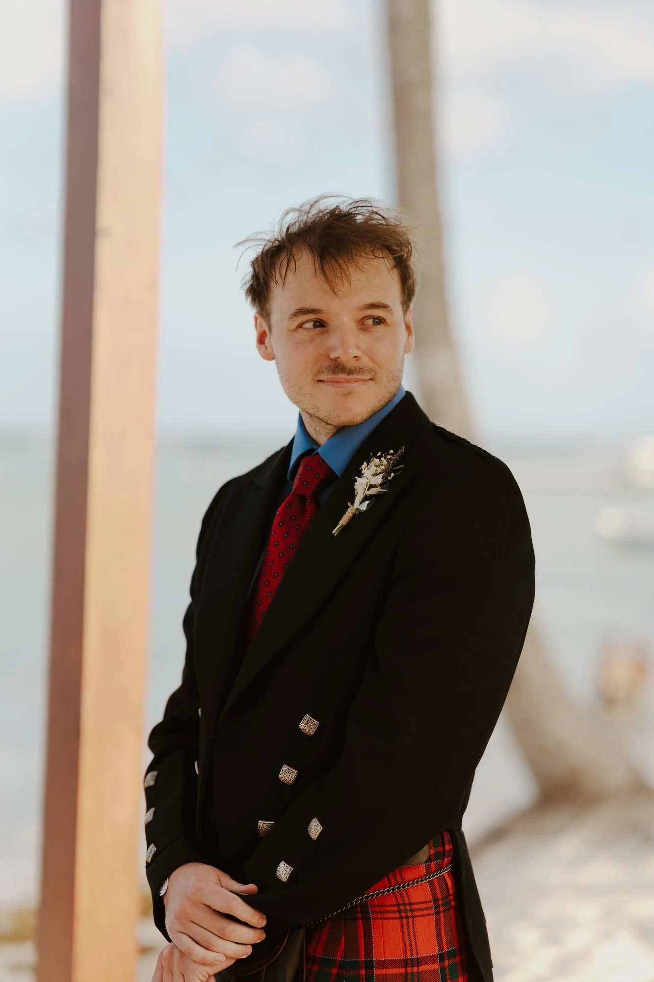 Groom in ceremony wearing a kilt and watching for the first time to his bride in Chez Bisutti Punta Cana Dominican Republic