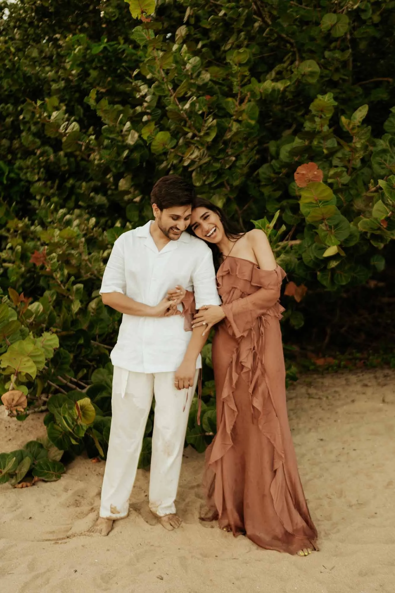 bride and groom looking at the camera in their engagement photoshot