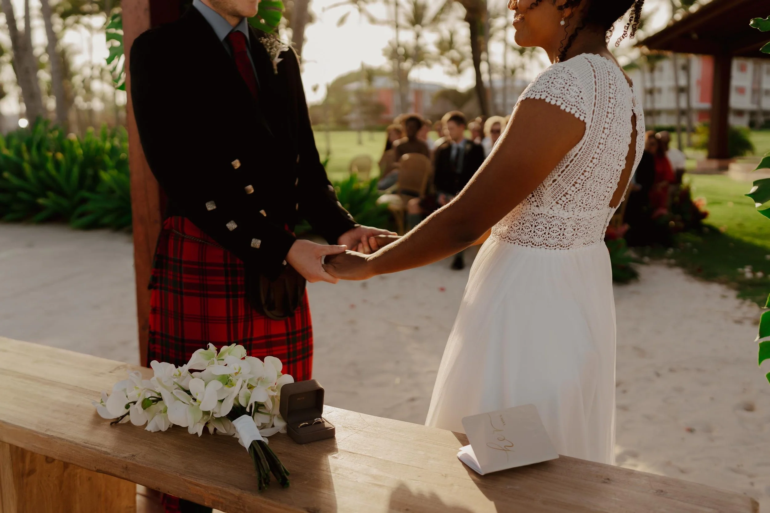 Bride and groom holding hands in ceremony and wedding Chez Bisutti Punta Cana Wedding Dominican Republic