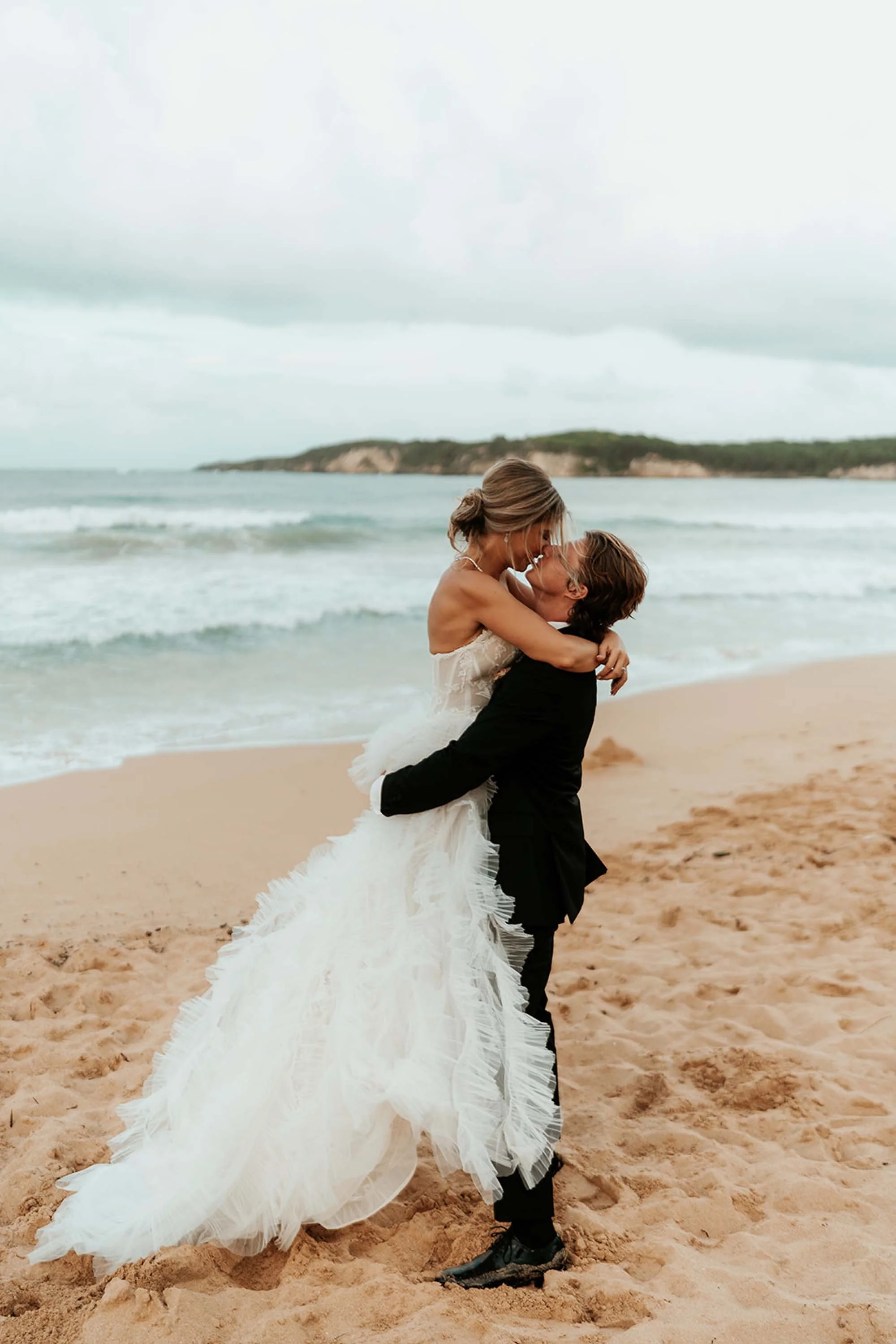 photo of the bride and groom. in the background you can see macao beach