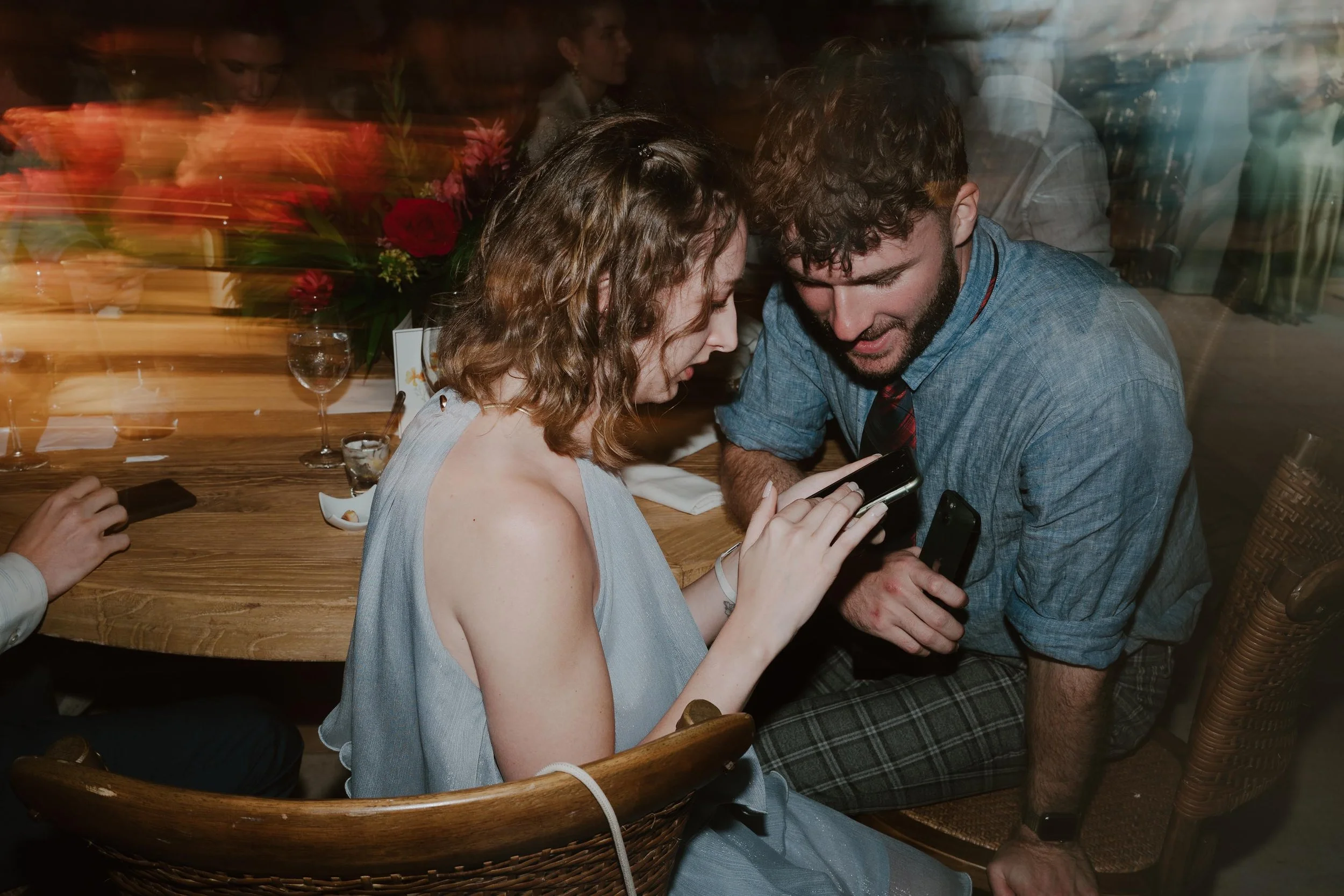 Candid and energetic wedding reception party in Punta Cana, with guests dancing and celebrating under warm lights