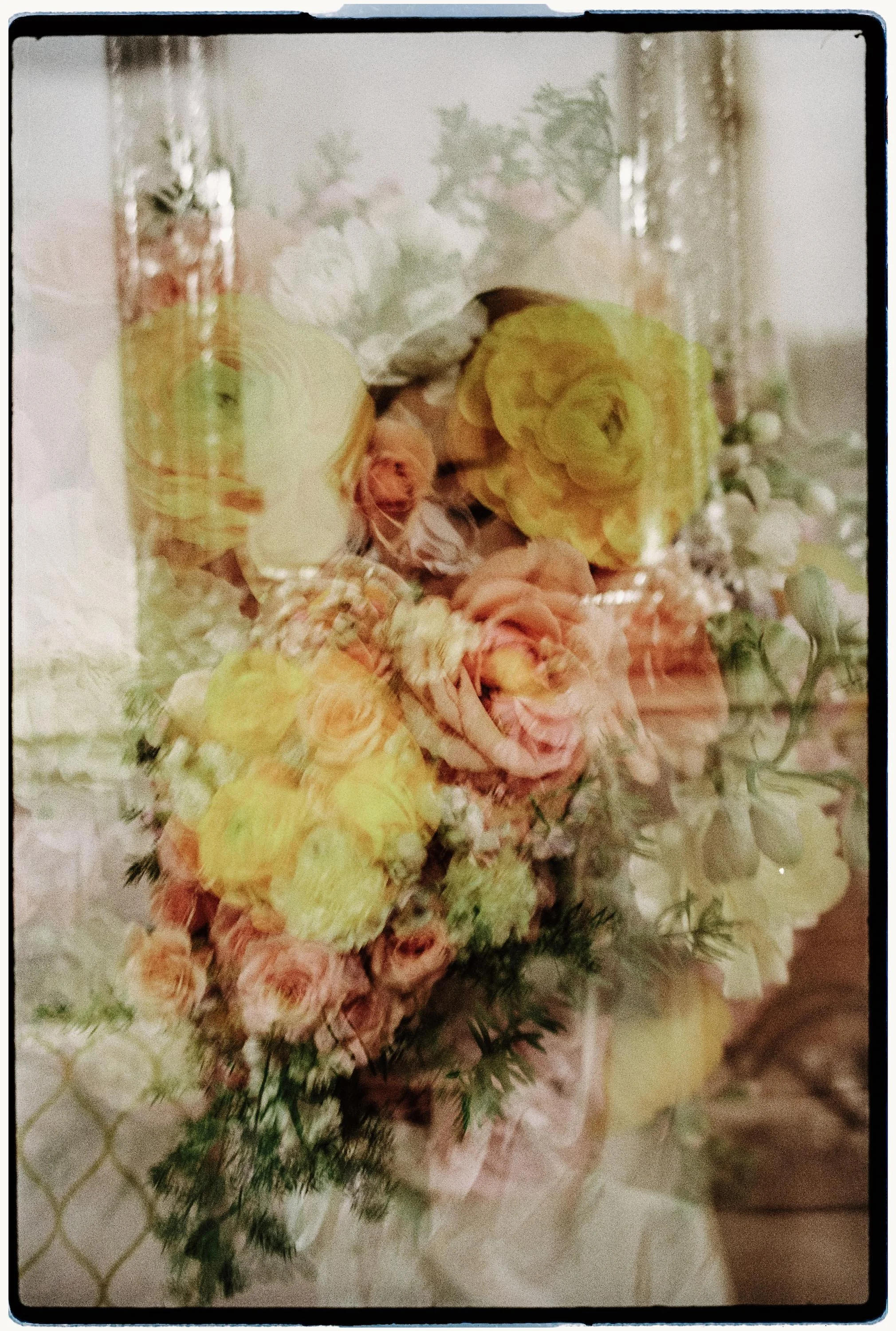 35mm film double exposure of a pastel yellow and peach bridal bouquet.