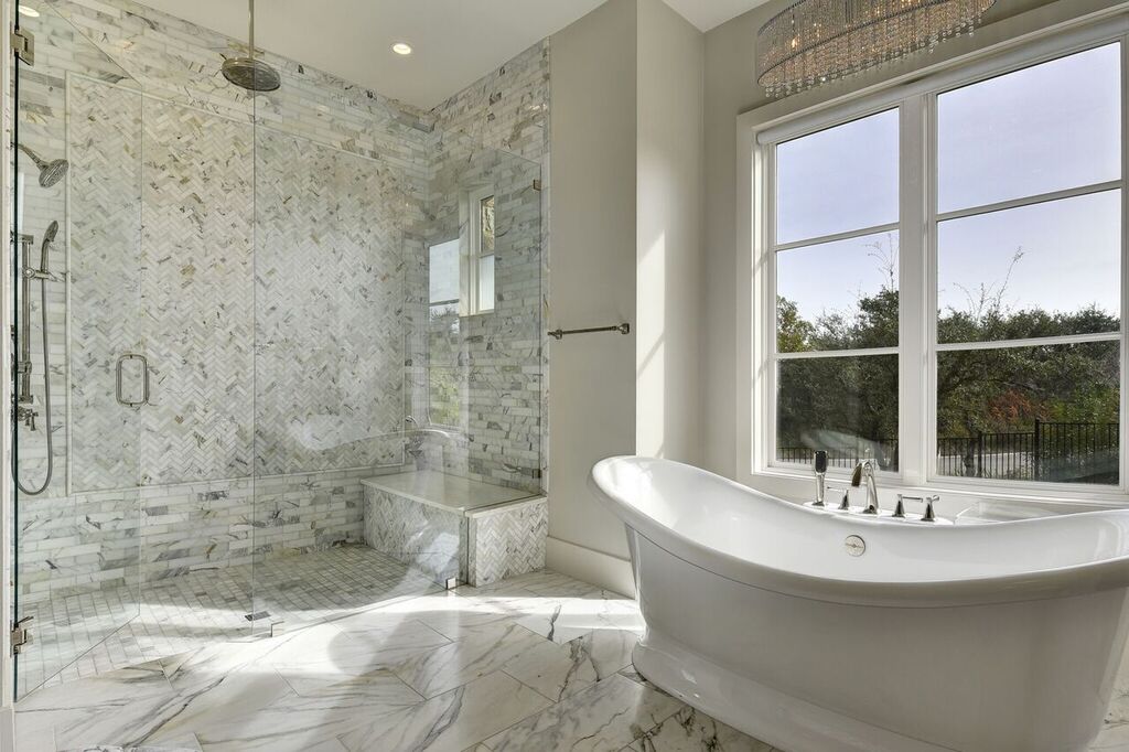 Bathroom Design with Carrara Marble Flooring and Shower