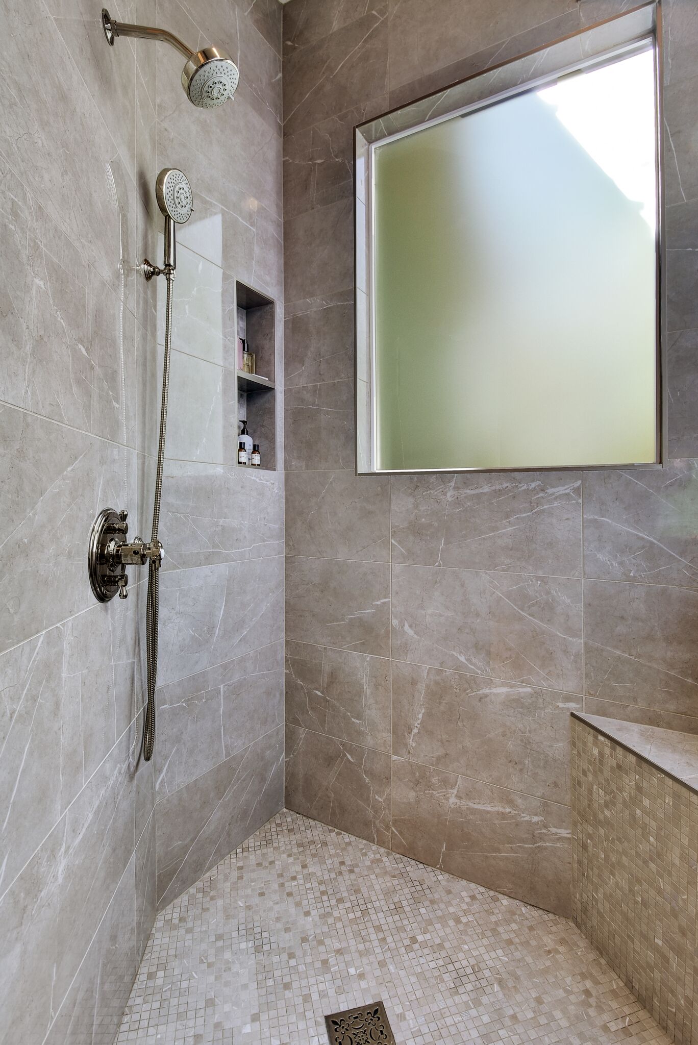 Walk in shower stall with beautiful shower tile