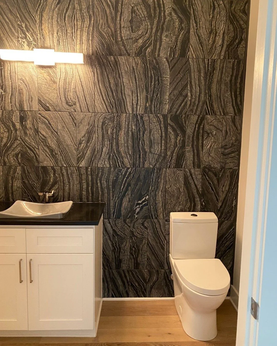 Tile wall in powder room is all you need