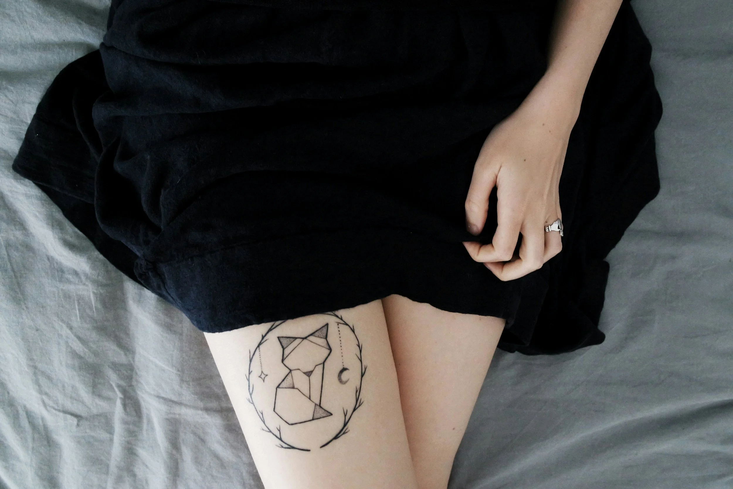 Image of a woman with a leg tattoo