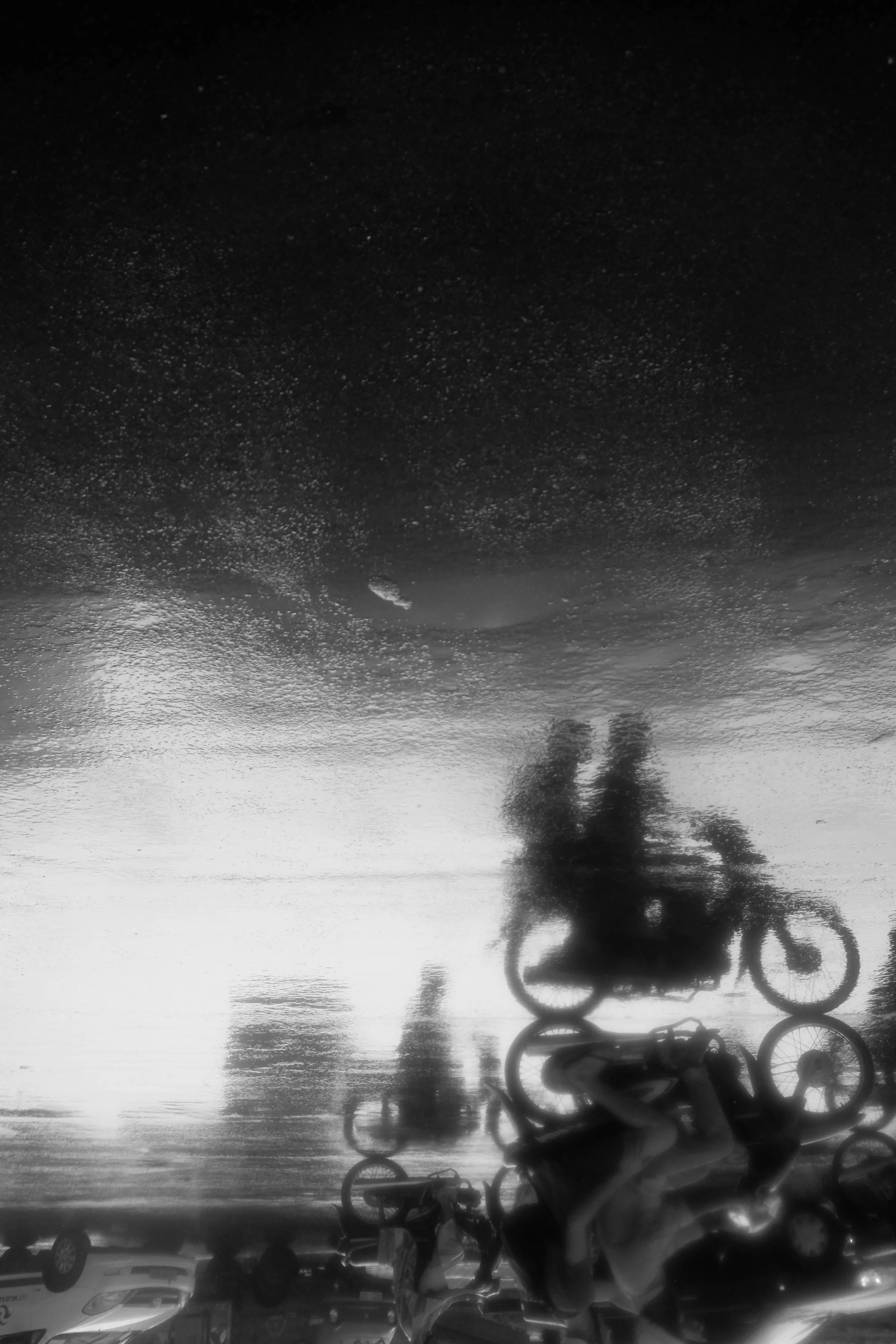 If it absolutely chucks it down I love to go cover my camera and go out barefoot to catch some shots.. there was so much rain in Saigon this day that the roads reflected. I took shots of the reflections and then flipped the photo.