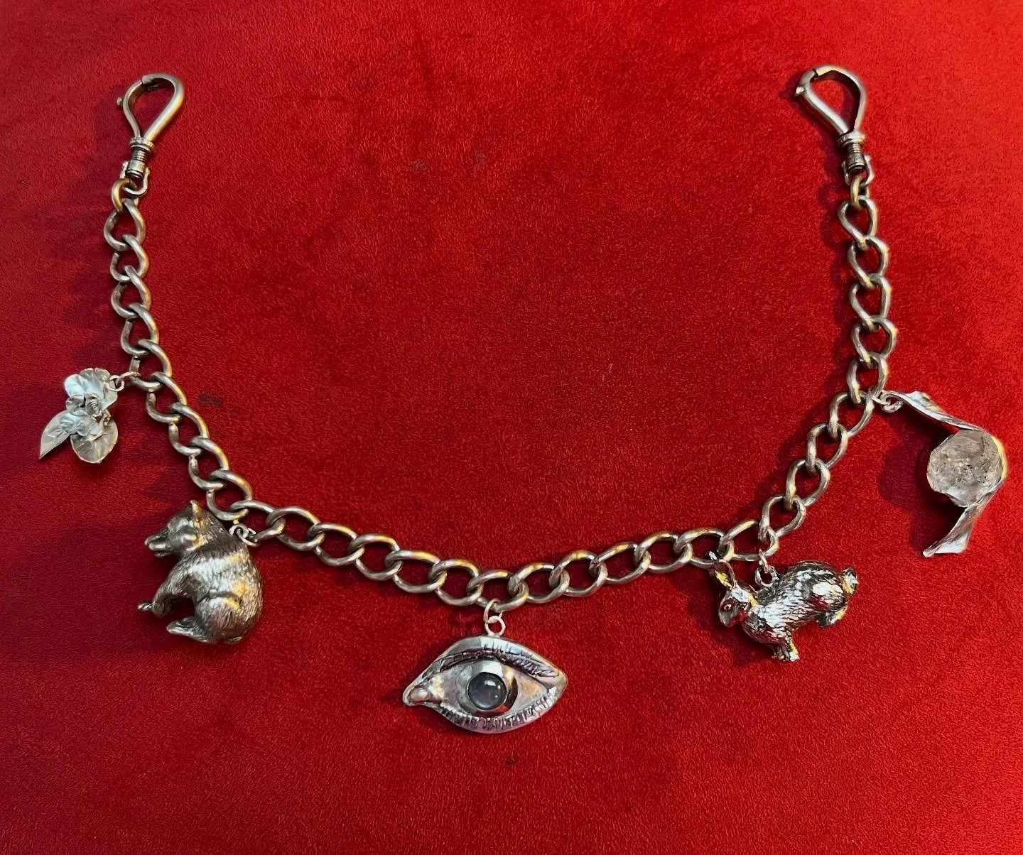 Remember the magnolia flower on the Charivari?
Now there are more.
Additional personalized pendants are finished being created for this family portrait Charivari depicting Mother, Daugther, Wife, Daughter and Father and is now ready to be hand de
