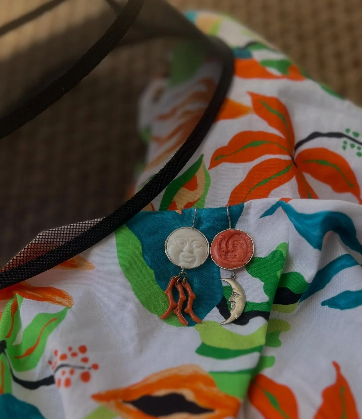 The morning after, my evenings jewels
Day and night
Sterling silver earrings set with an antique carved natural coral, a plastic ‘feve’ and antique celluloid coral
Suzette reimagines collected items from secondhand and antique flea m