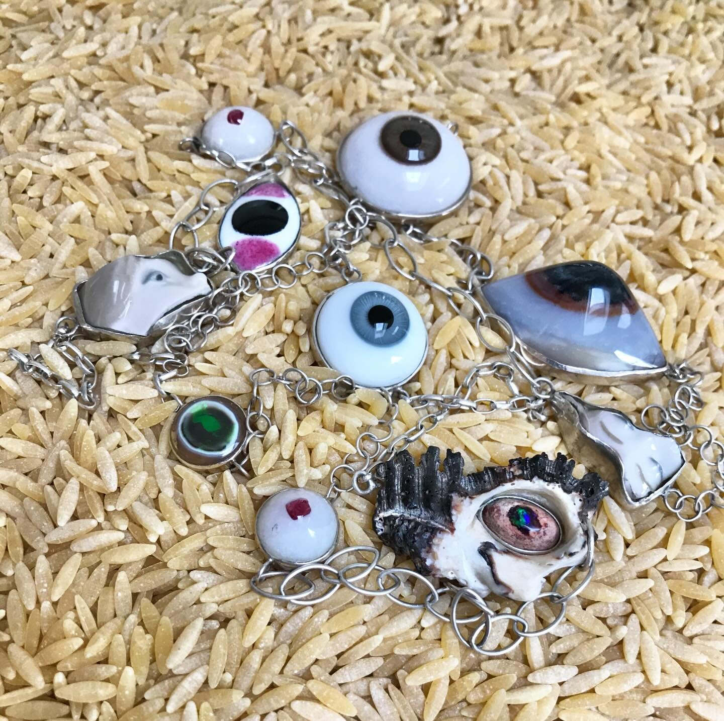 I See! 
 
A sautoir of collected eyes set in repurposed vintage sterlingsilver chains. 

The evil eye is a curse believed to be cast by a malevolent glare, usually given to a person when they are unaware. Many cultures believe that receiving the evil