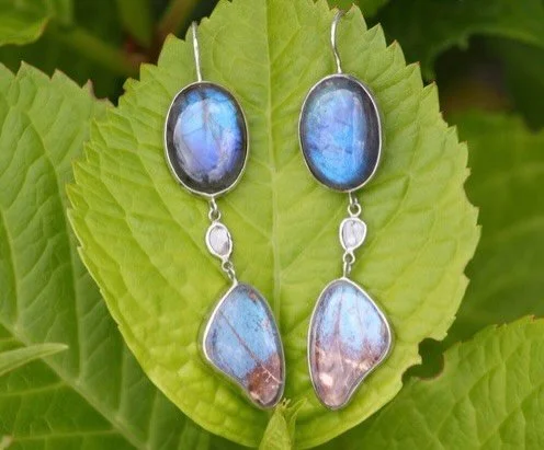 Ephemeral! 

Another preview of our show &lsquo;Entre ciel et mer&rsquo; this coming weekend June 12/13 Espace Brouchier Cannes la Bocca 
 
Elegant hanging earrings of labradorite moonstone, diamond and butterfly wings set under rock crystal cabochon