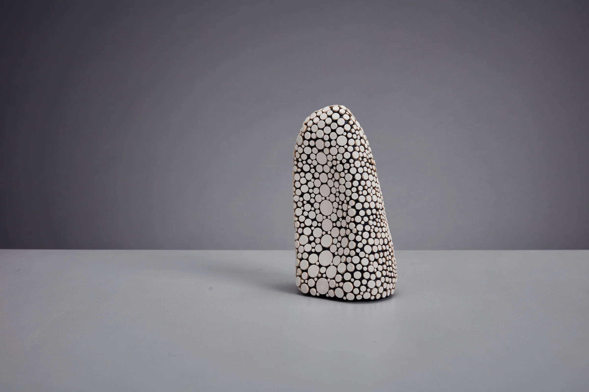 SPECIMEN No. 01 Date of Creation : 10/2017 Material : Italian Leather & Welsh holly wood Size : Width: 7.5cm, Depth: 6cm, Height: 12cm Weight: 0.181 kg Process : Carved wood, Fused with leather disks.
