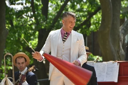 Michael Arenella and His Dreamland Orchestra Michael Arenella is a musician, crooner, bandleader and impresario best known for leading his Dreamland Orchestra at his Jazz Age Lawn Party on New York’s Governors Island. Michael’s love of Jazz Age culture inspired him to throw the first Jazz Age Lawn Party in 2005 for an intimate group of friends and fellow torch carriers of a bygone era. While first timers might have thought it a historical reenactment, to Michael, his orchestra and his admirers it was all genuine. For Michael, the Jazz Age never really ended, it just fell asleep. Today, he reawakens it wherever he plays. Now, whether on Governors Island or South Beach, this living legacy is again vital within the zeitgeist of the present.