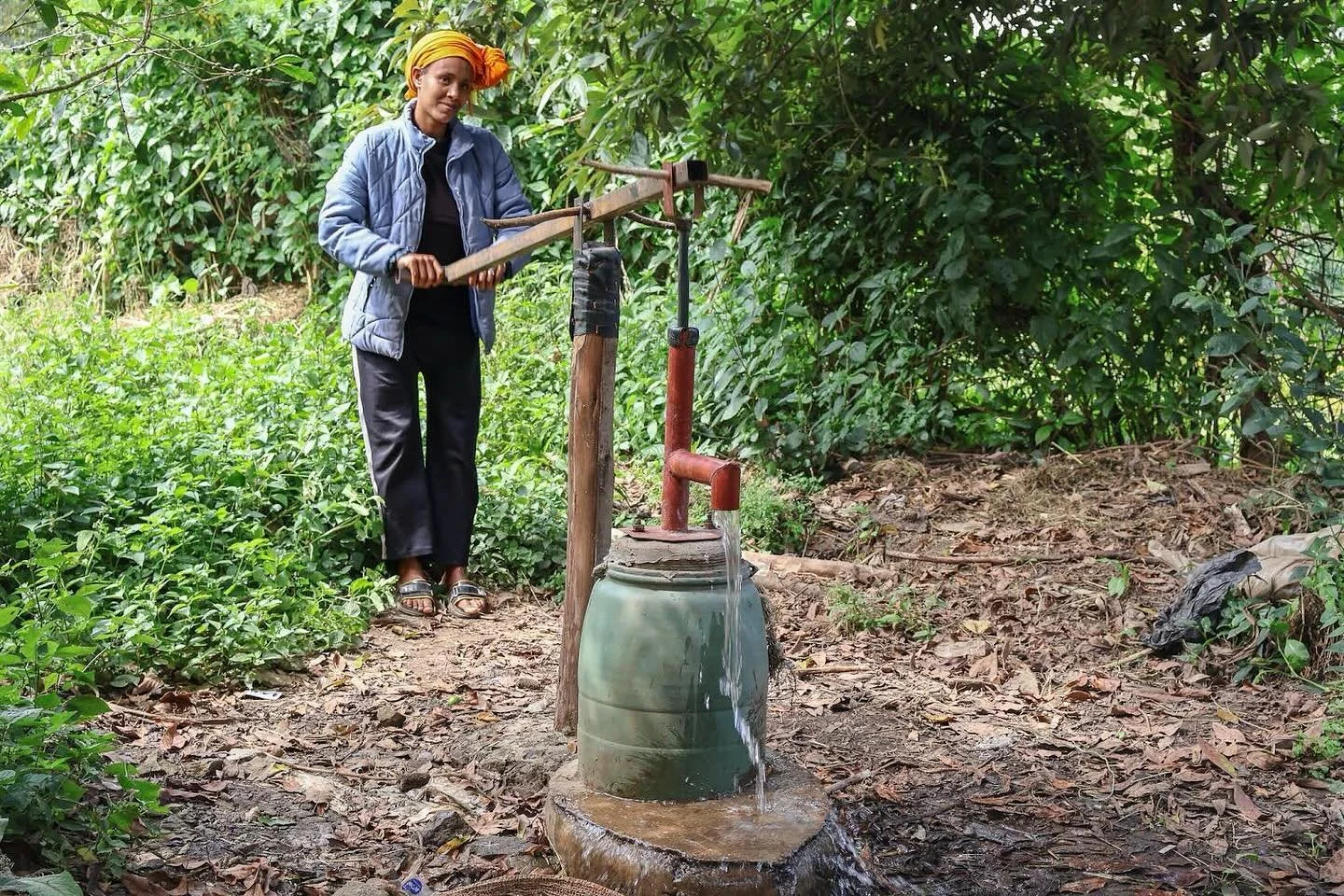 Ethiopian Woman using her new well, drilled using the &ldquo;Baptist&rdquo; method of well drilling. For more information on this method of drilling, please see our website.