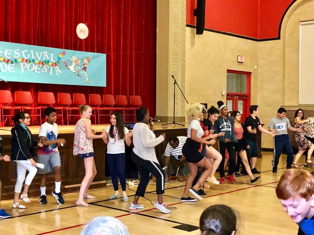 Reyna y Real perform at DCPS bilingual elementary school, Oyster Adams, during the school's Poetry Festival.