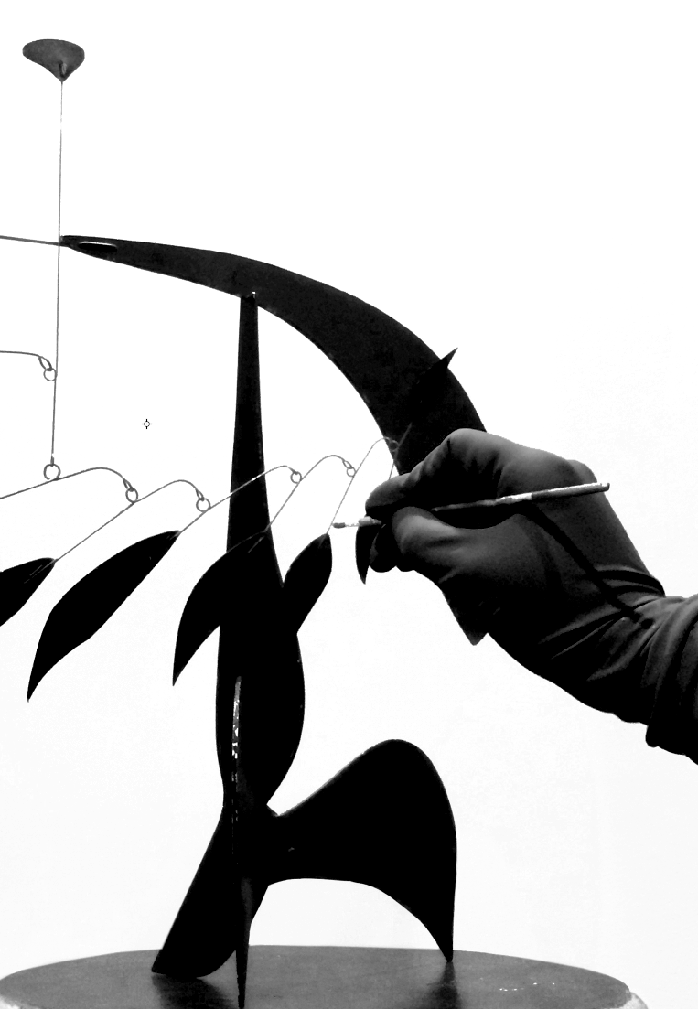 Chanduví touching up a Calder Mobile , 2015