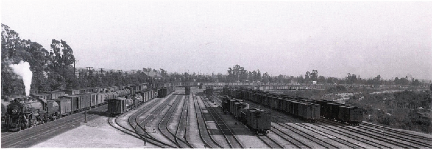 Taylor Yard, near the original northern city boundary. The receiving tracks at the north end of the facility are visible, with the main line tracks at far left and the Los Angeles River at right. —John Signor Collection