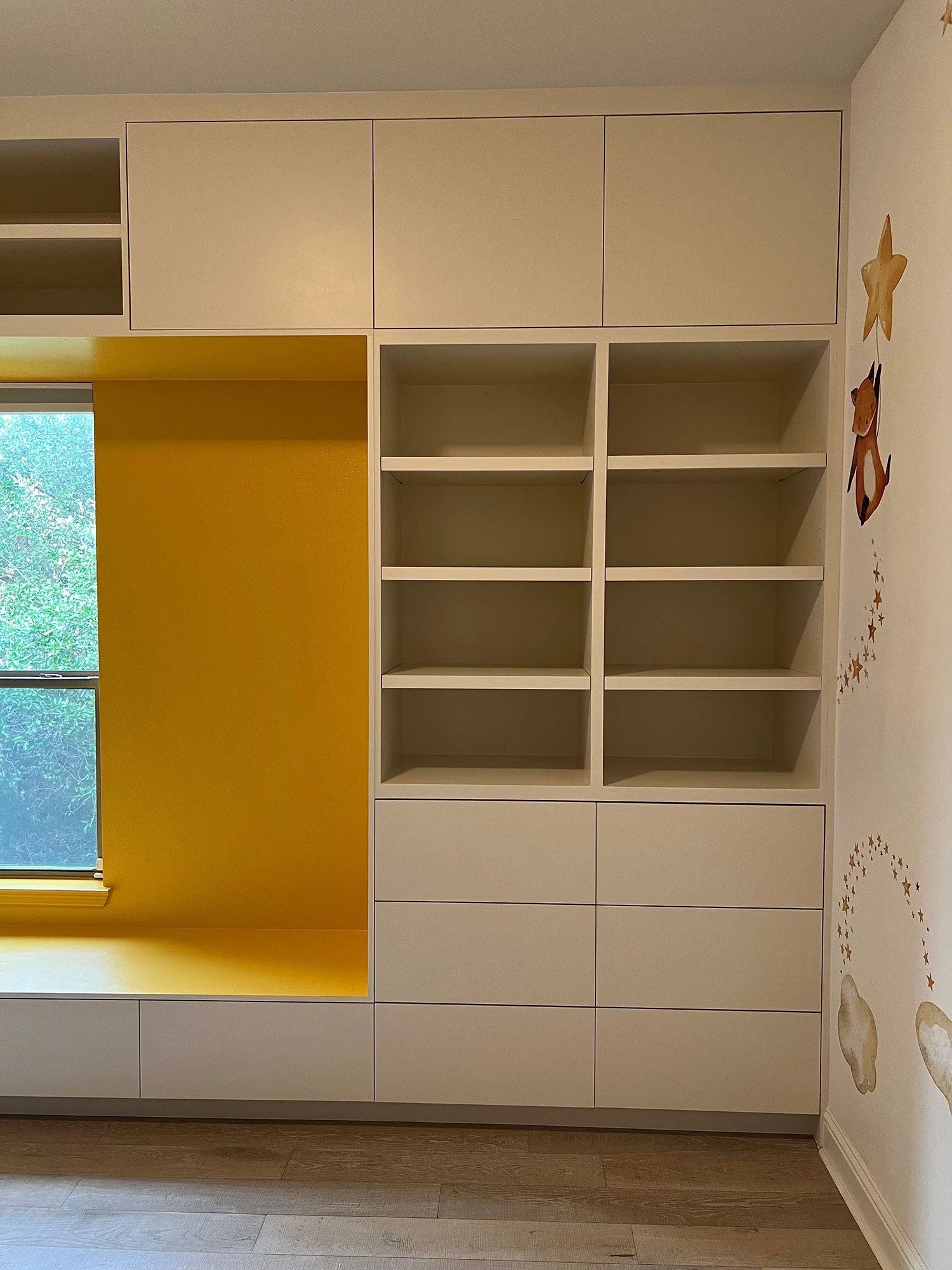  Three doors and nine drawers with push-to-open hardware creates a sleek and modern look. 