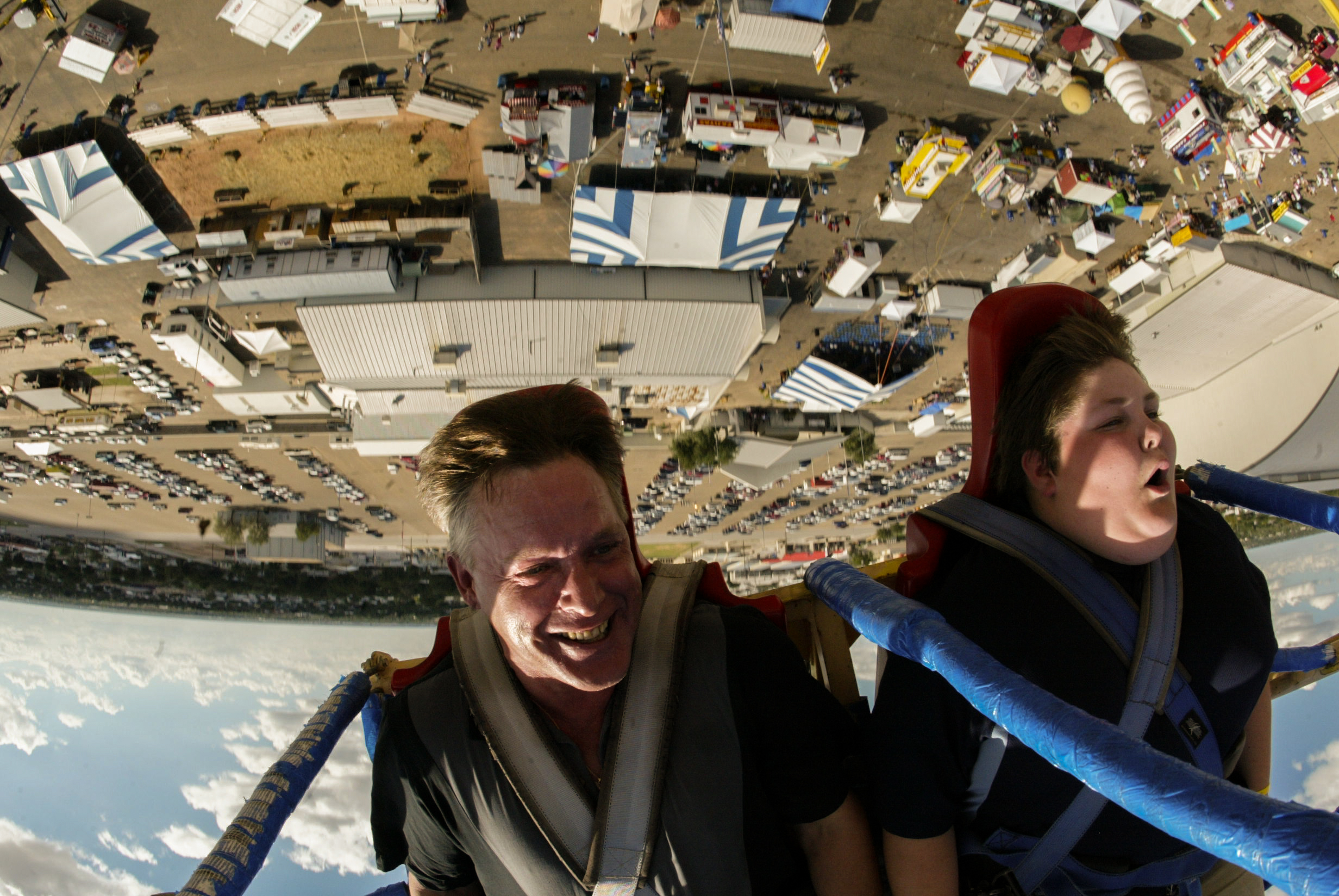  Friends Rob Mann, left, and Garrett Davis, 14, ride the Ejection Seat during the Permian Basin Fair & Exposition Sept. 13, 2008, at the Ector County Coliseum in Odessa, Texas. Riders strapped to the seat are shot about 180 feet into the air on the i