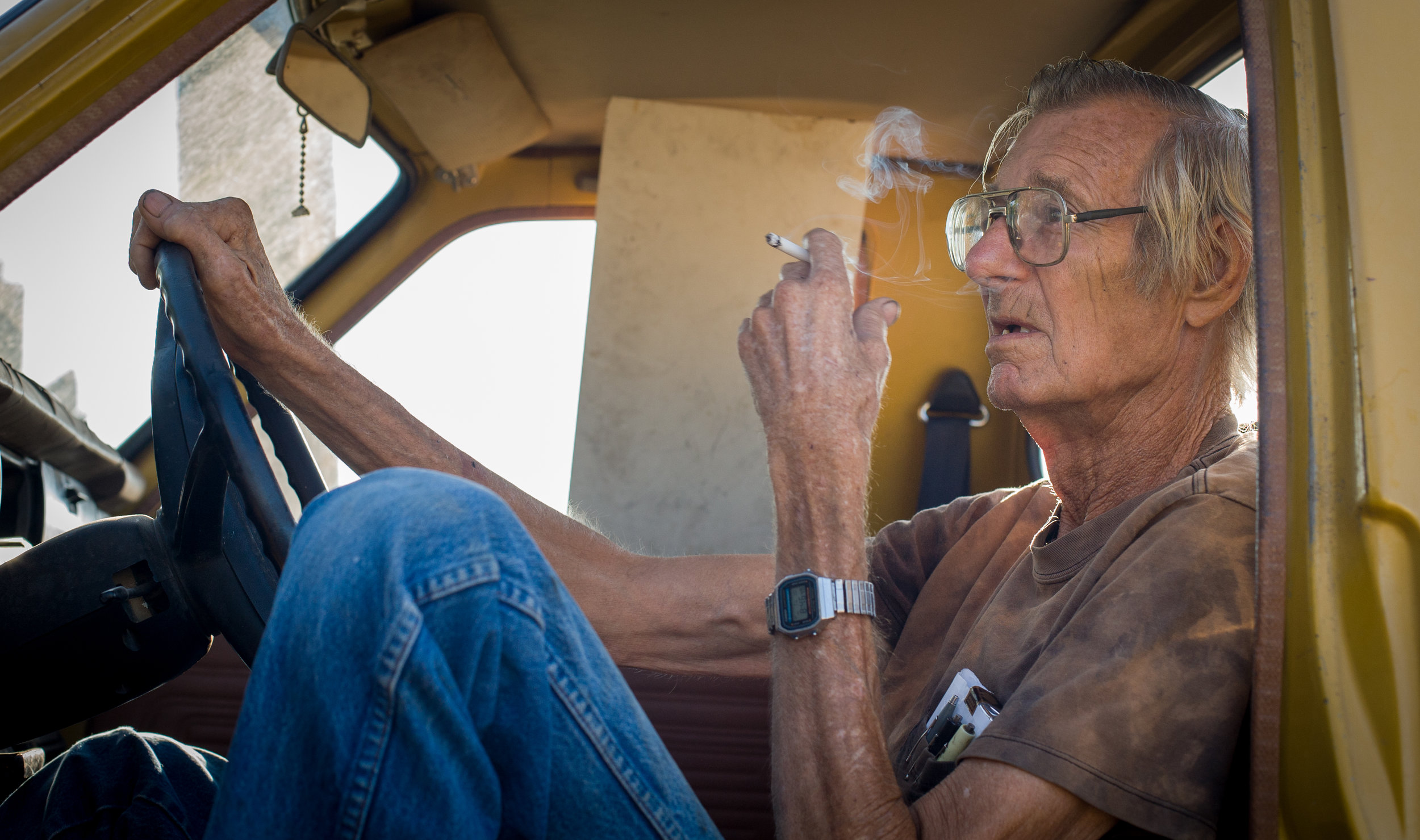  A mechanic takes a smoke break before starting the work day August 10, 2010, in Odessa, Texas. 