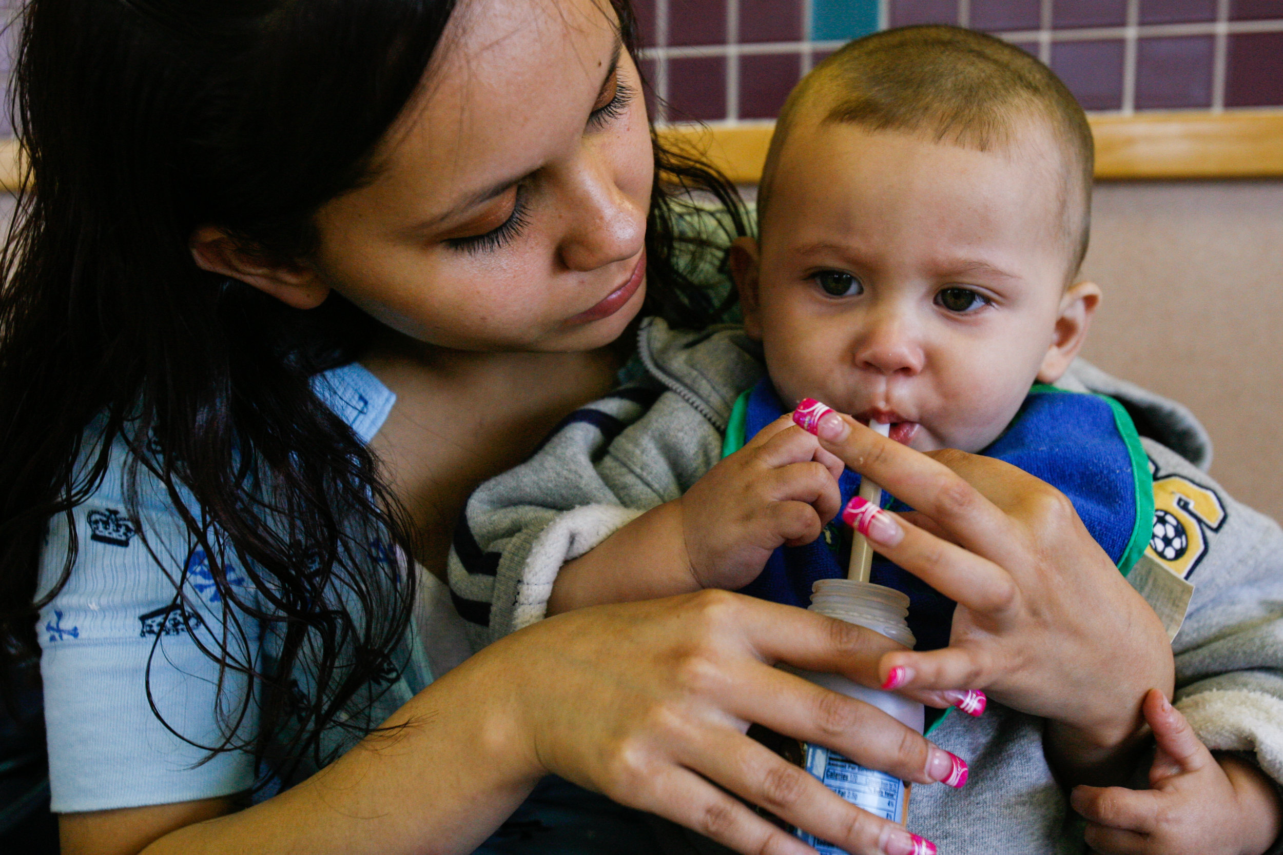  Susana Dominguez, 17, helps her one-year-old son, Gabriel Acosta IV, finish his lunch April 4, 2008, at a fast-food restaurant in Odessa, Texas. Dominguez said that sometimes she's in such a rush to feed her son she doesn't have time to eat during t