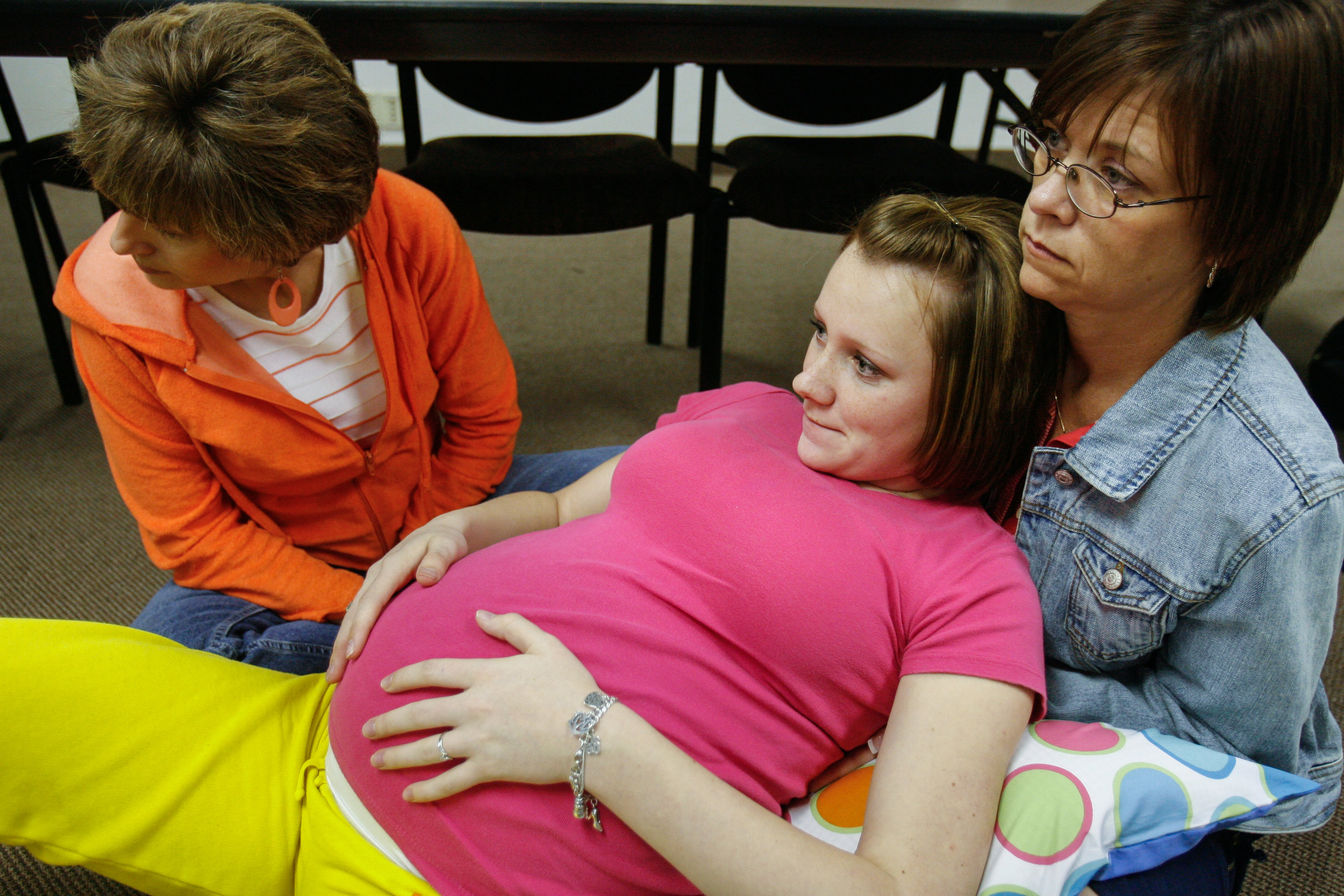  Amy Saulsbury, 17, center, practices different positions for labor with her coaches during a birthing class  March 13, 2008, at Medical Center Hospital in Odessa, Texas. Her coaches were her mother, Jill Saulsbury, right, and family friend Cindy Fry