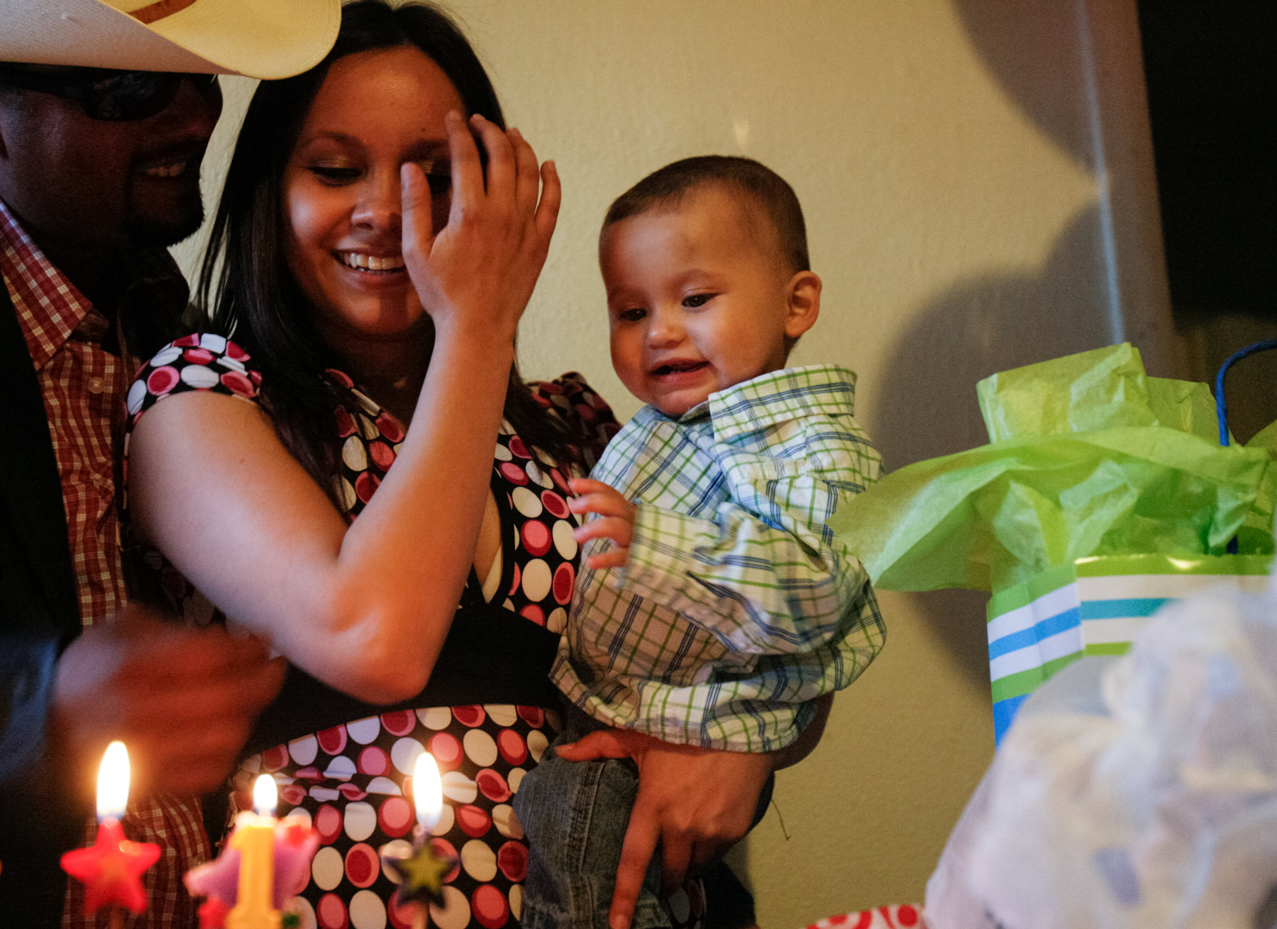  Gabriel Acosta III, from left, and Susana Dominguez, 17, sing to their one-year-old son, Gabriel Acosta IV, during his birthday party April 12, 2008, in Odessa, Texas. 