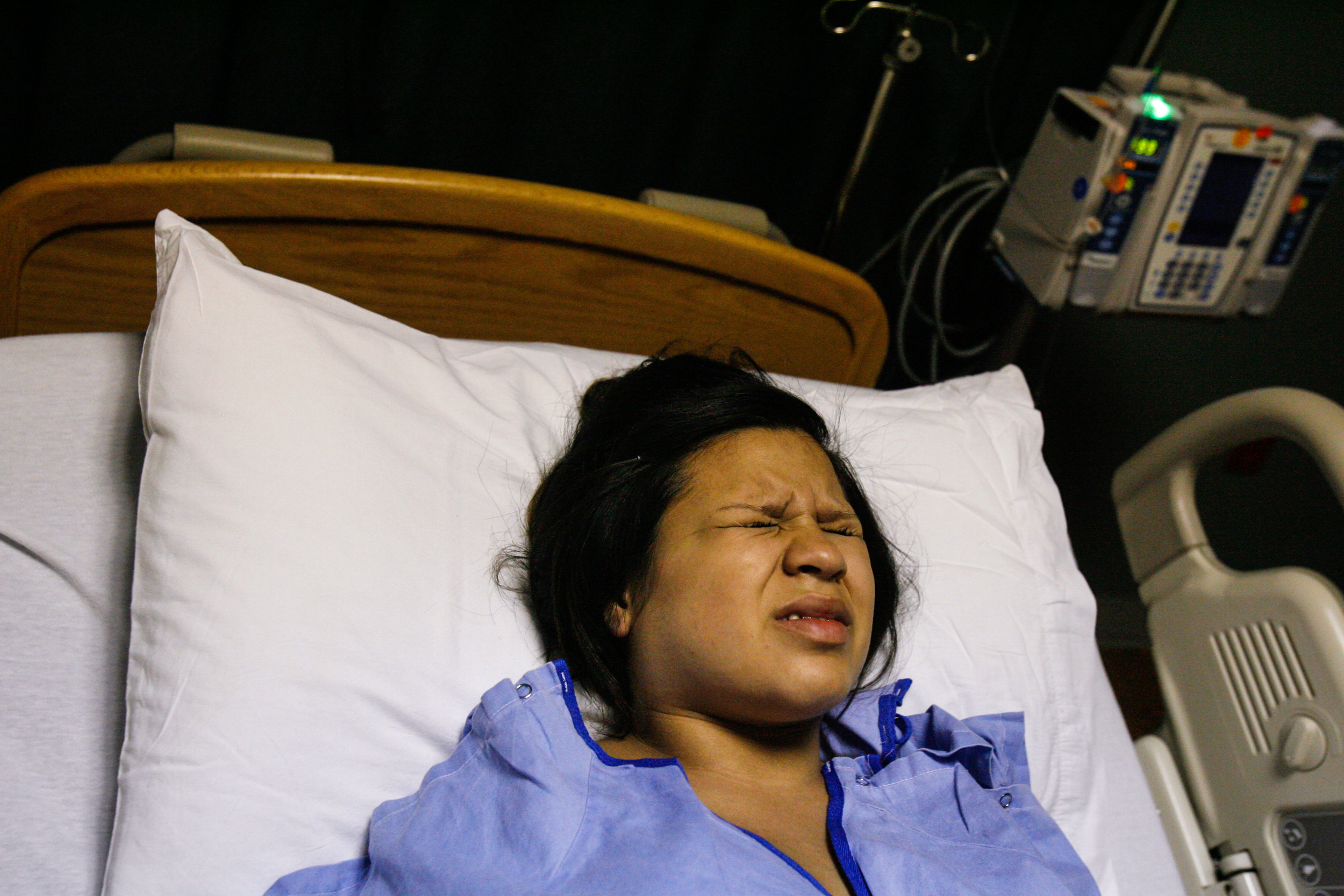  Deana Martinez, 17, grimaces during a contraction while in labor May 21, 2008, at Medical Center Hospital in Odessa, Texas. Martinez was in labor for 32 hours before she delivered, and spent the day at school before checking into the hospital. 