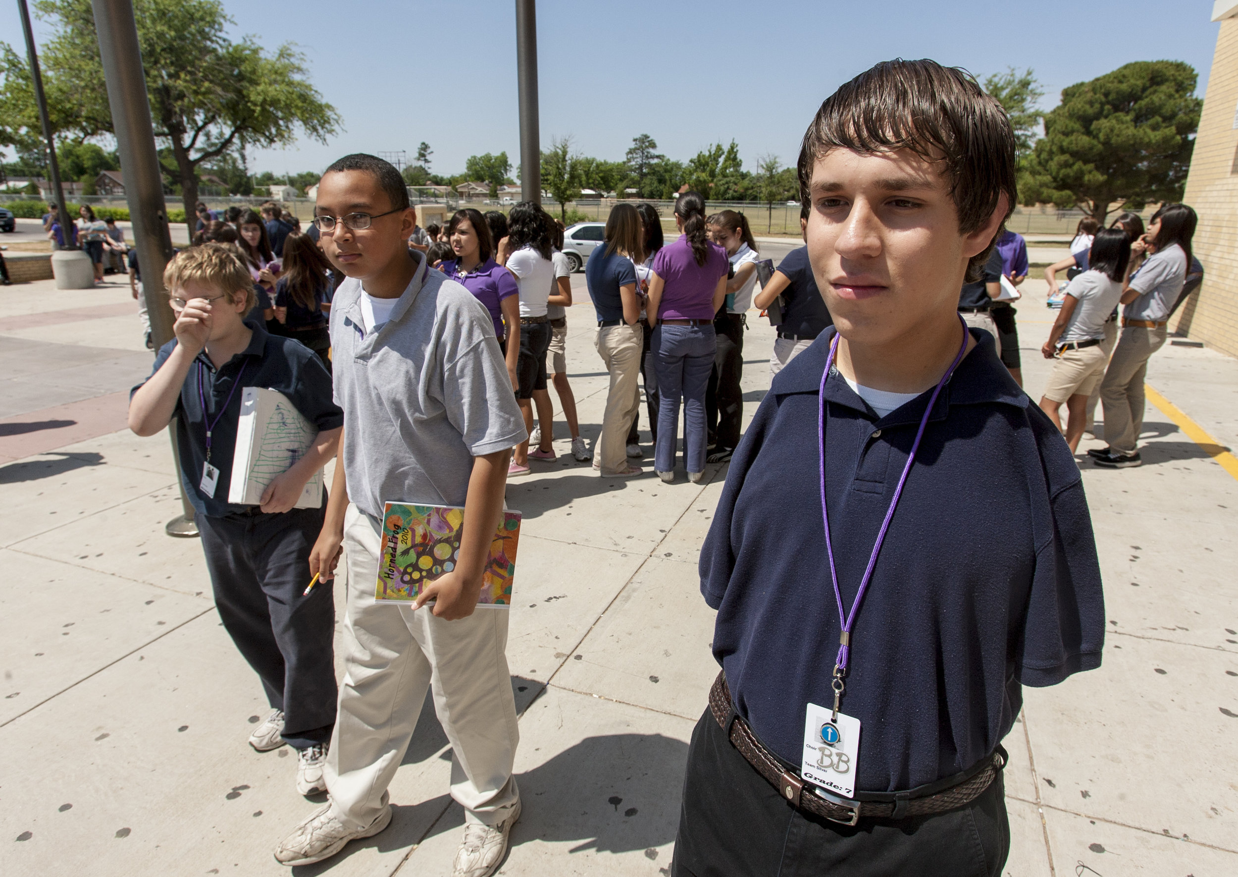  Jesse Flores and his classmates pass the time outside after lunch Tuesday, May 18, 2010, at Bowie Junior High in Odessa, Texas. Flores was born without arms, but said he's less concerned about his lack of arms than with the potential of going throug