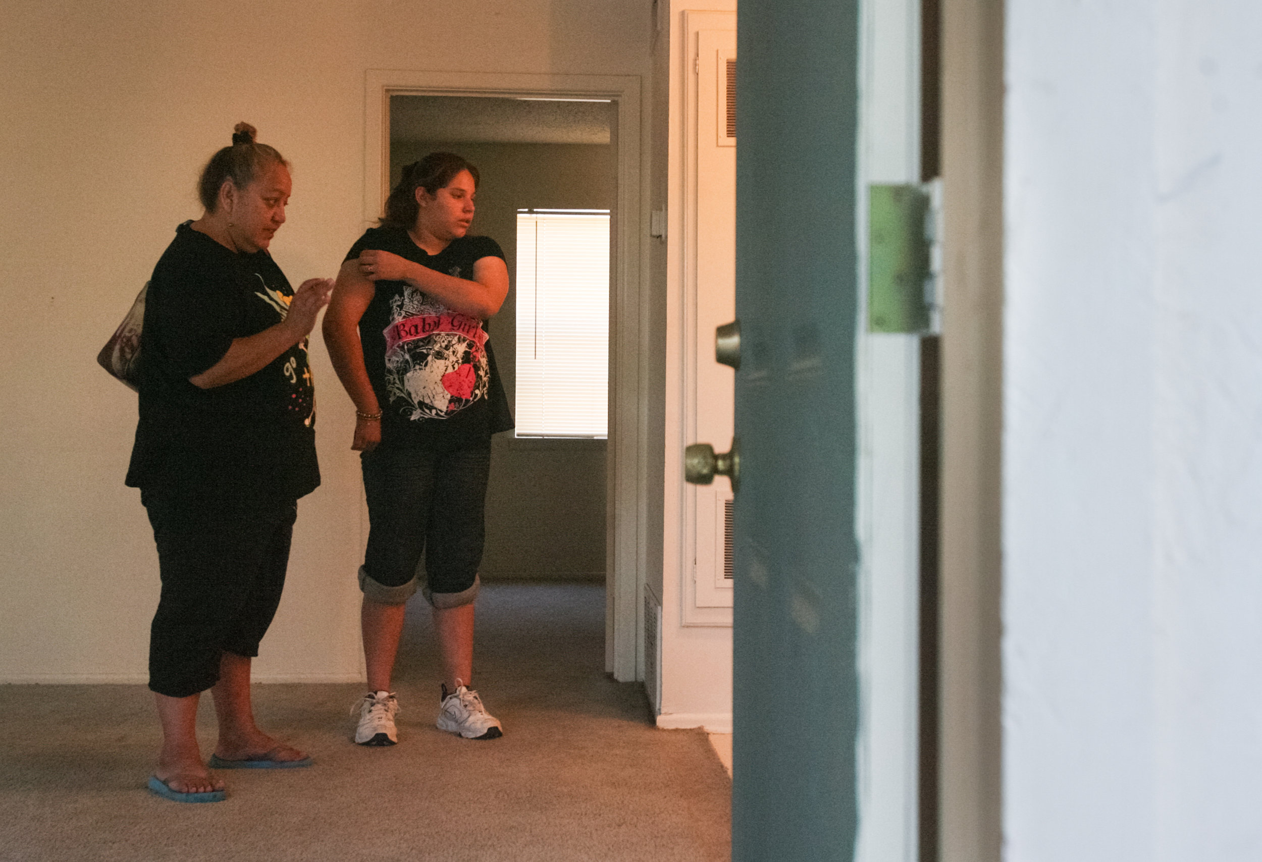  Juanita Torres, left, and Angelica Brito, 12, discuss amenities and policies of their new apartment with a property manager Sept. 6, 2008, after signing the paperwork to move earlier in the day. The mother and daughter were without stable housing fo