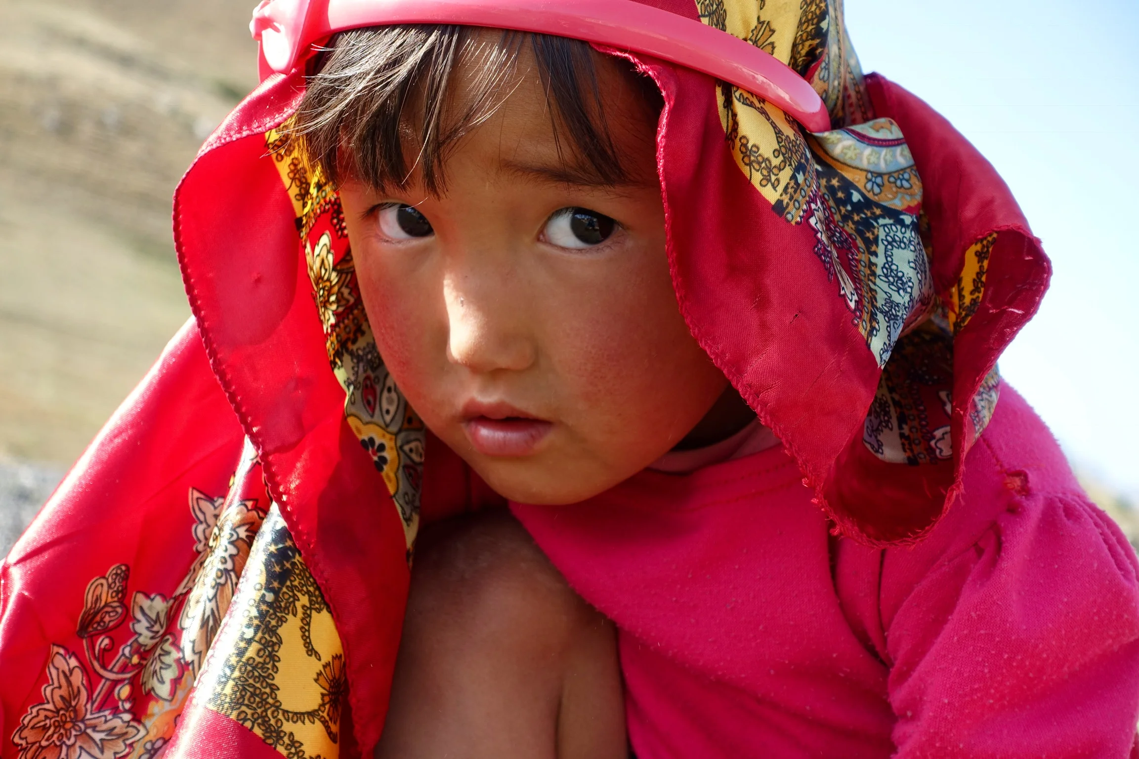 Shy little girl on the way to Sary Tash