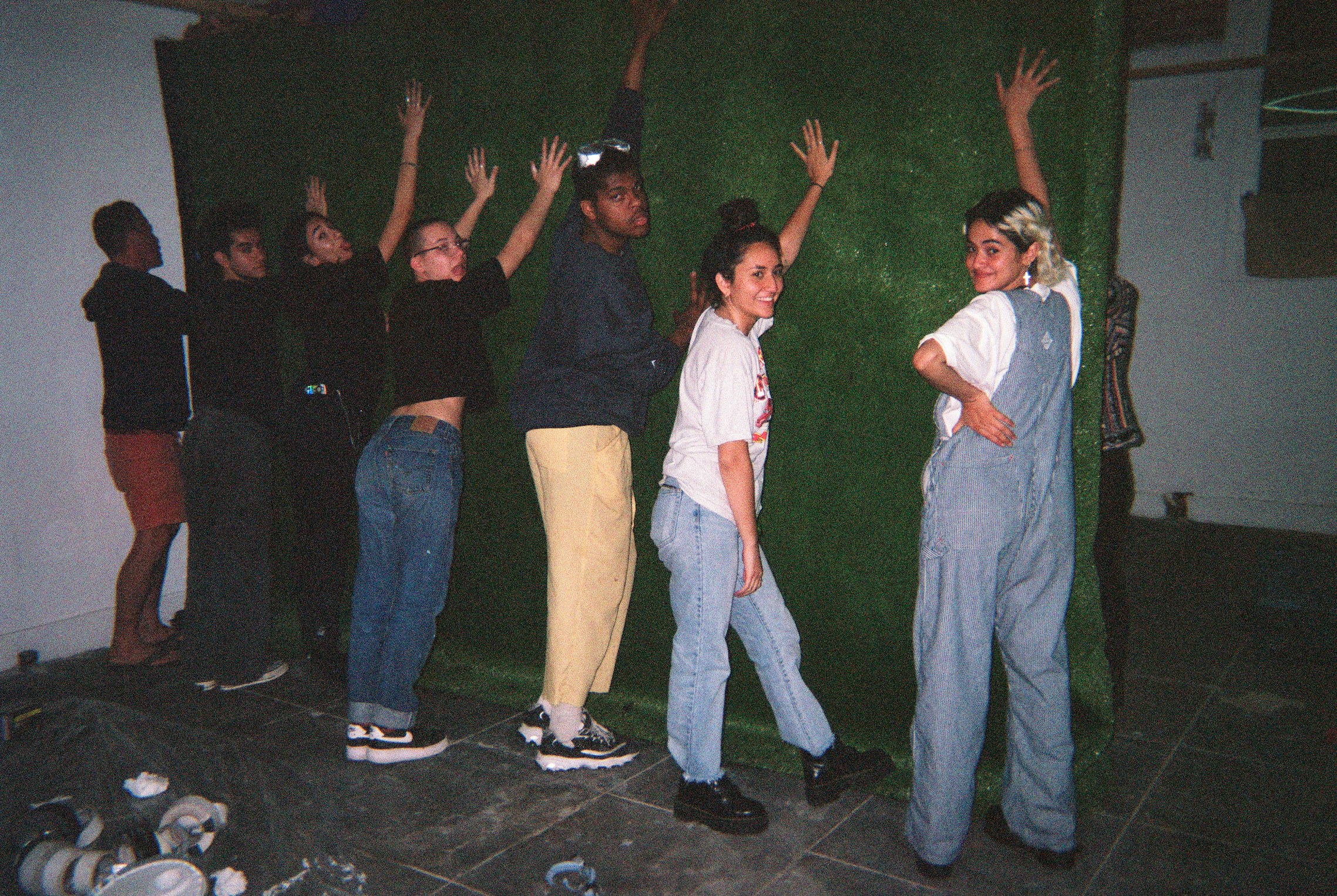 Hanging up astroturf on Kaitlyn’s wall by Paige MacCready @ paigemaccready