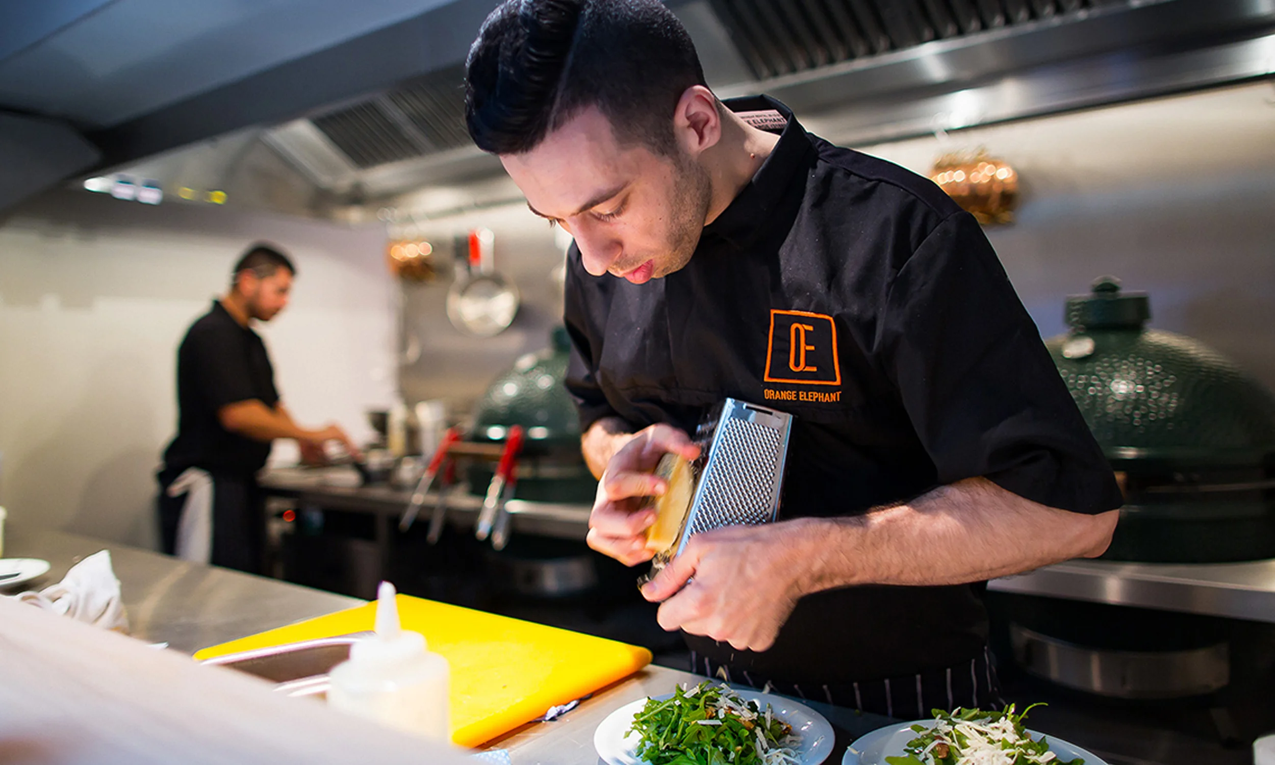 Orange Elephant staff uniforms graphic design.