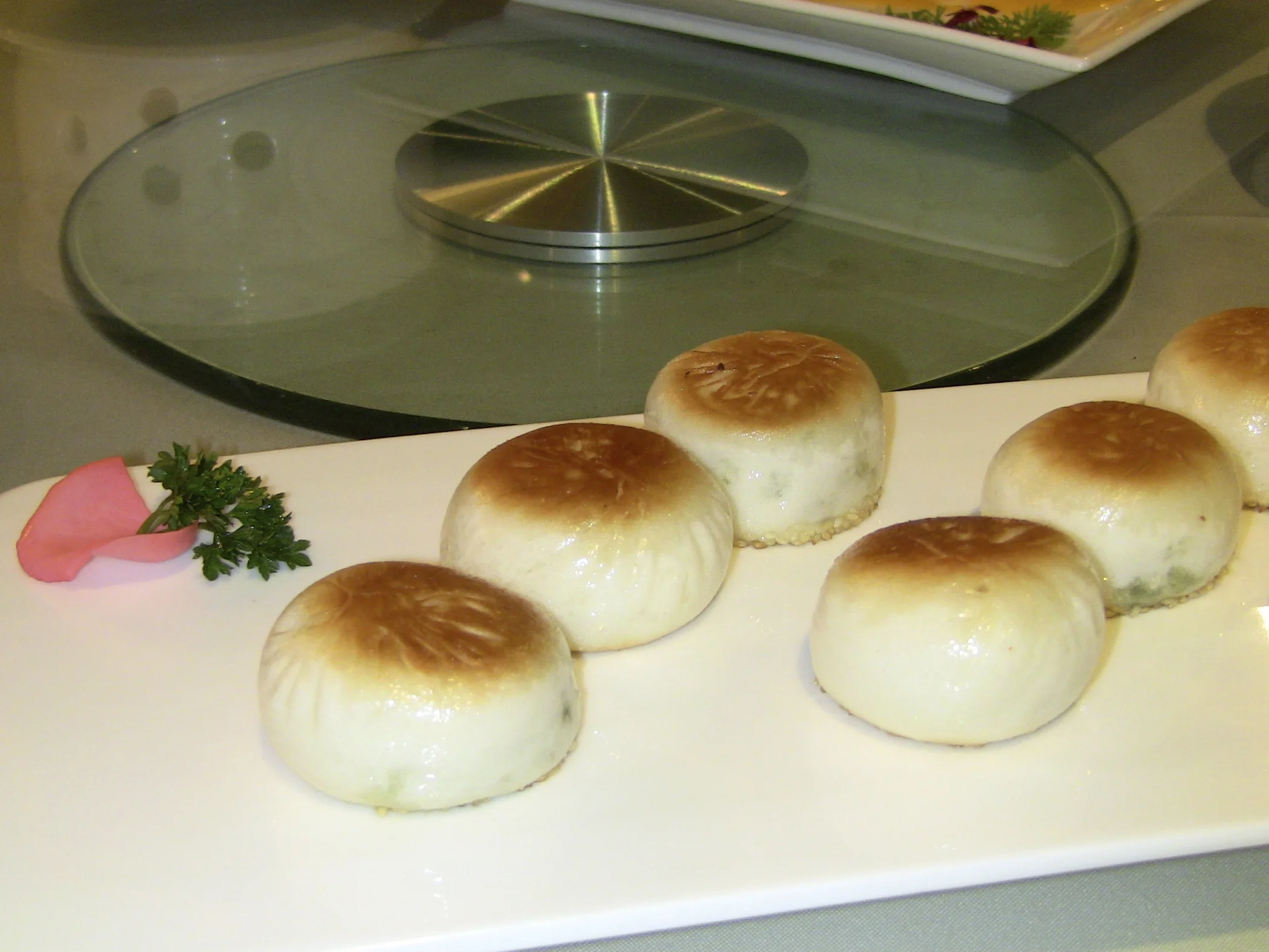 These are various steamed buns both sweet and savory styles.