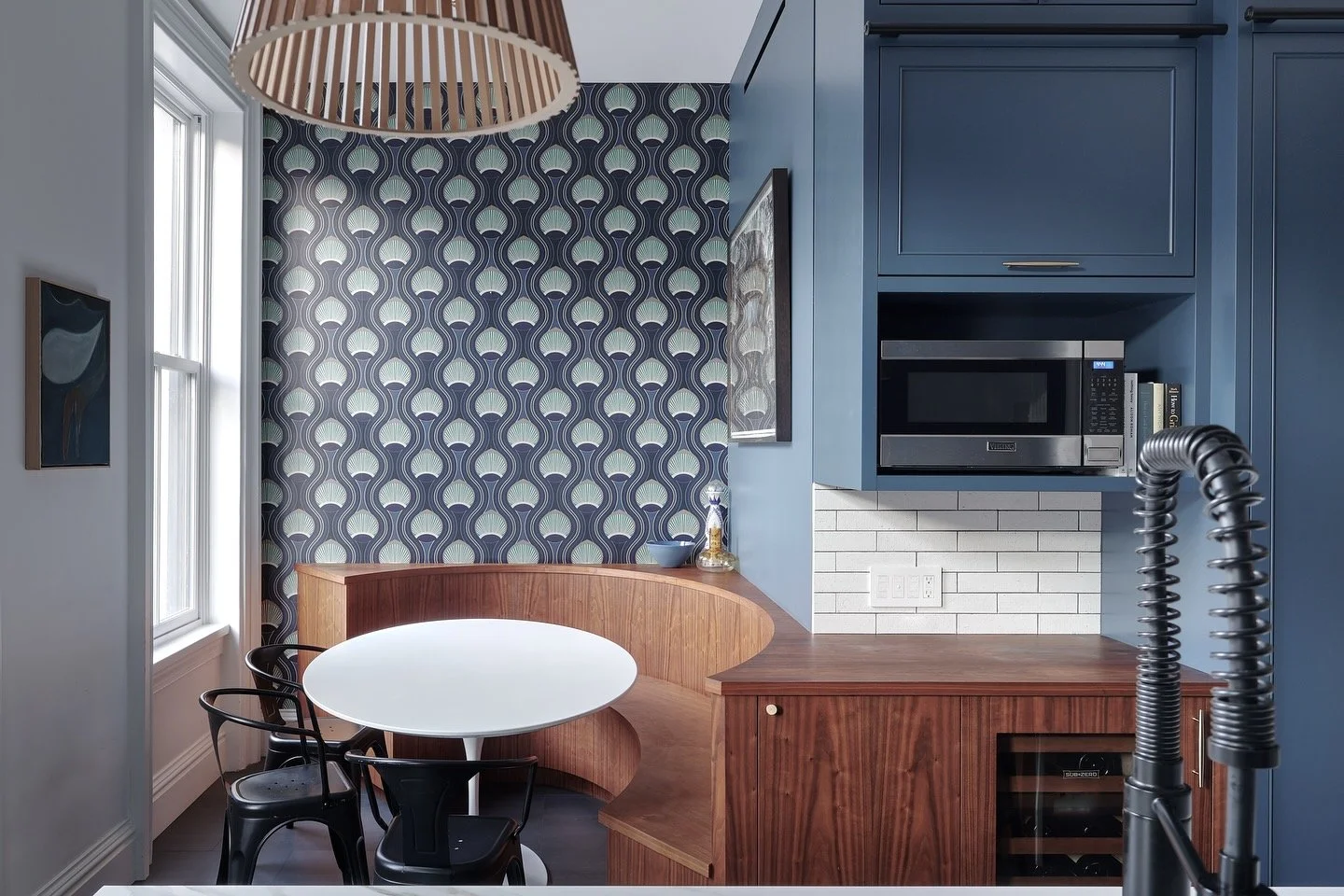Oval-shaped banquette cut off at a diagonal to fit gracefully into this small breakfast nook. 

#architecture #interiordesign #kitchendesign #banquette #breakfastnook #townhouse #renovation